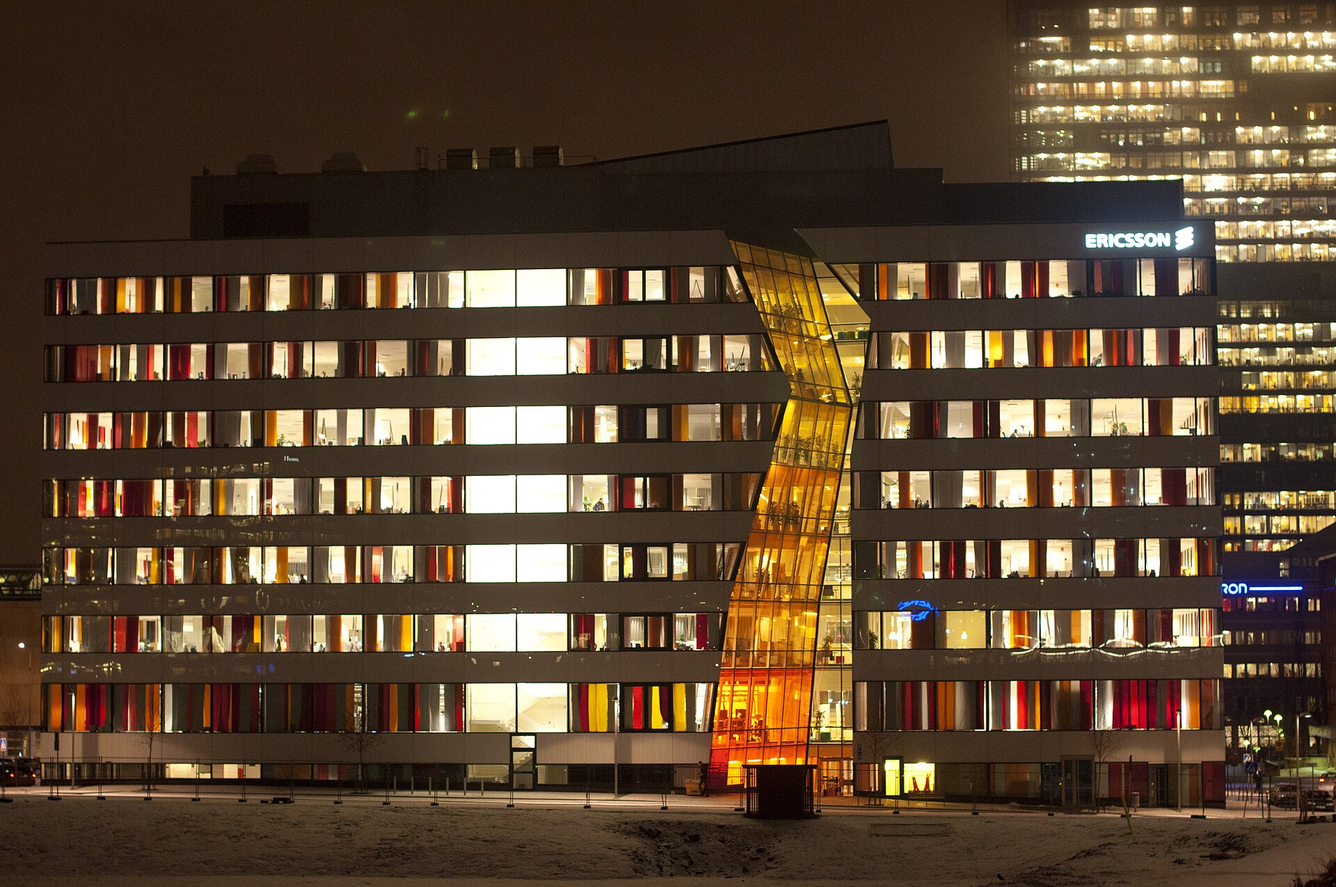 Ericsson office building illuminated at winter dusk in Kista