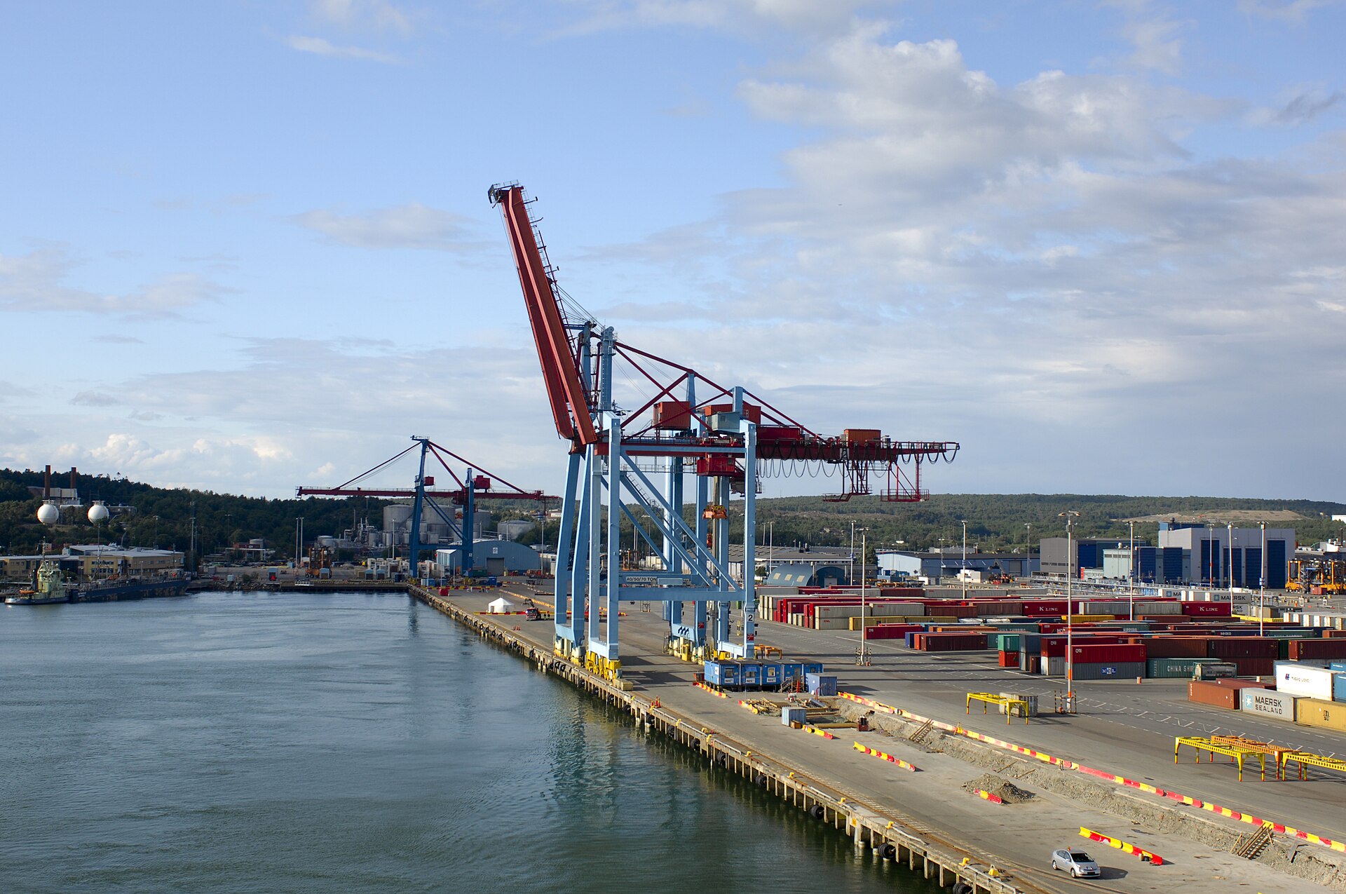 A large port crane standing above transport infrastructure in Gothenburg.