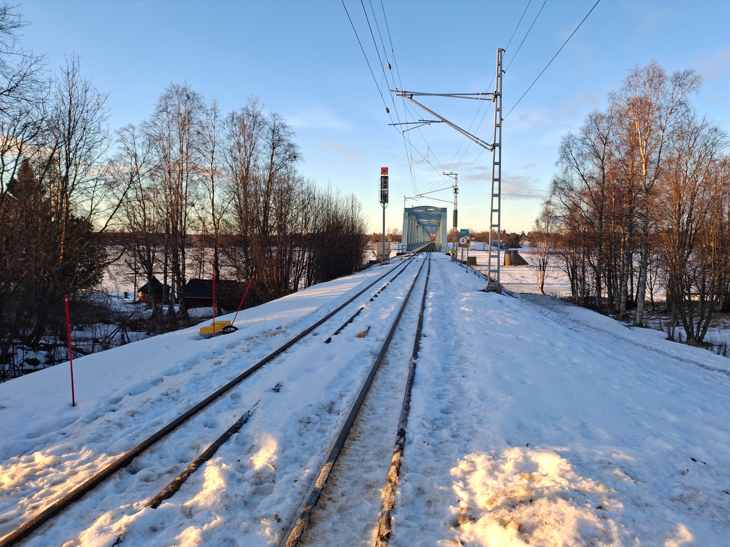 The electrified railway bridge across the Torne River between Haparanda and Tornio.