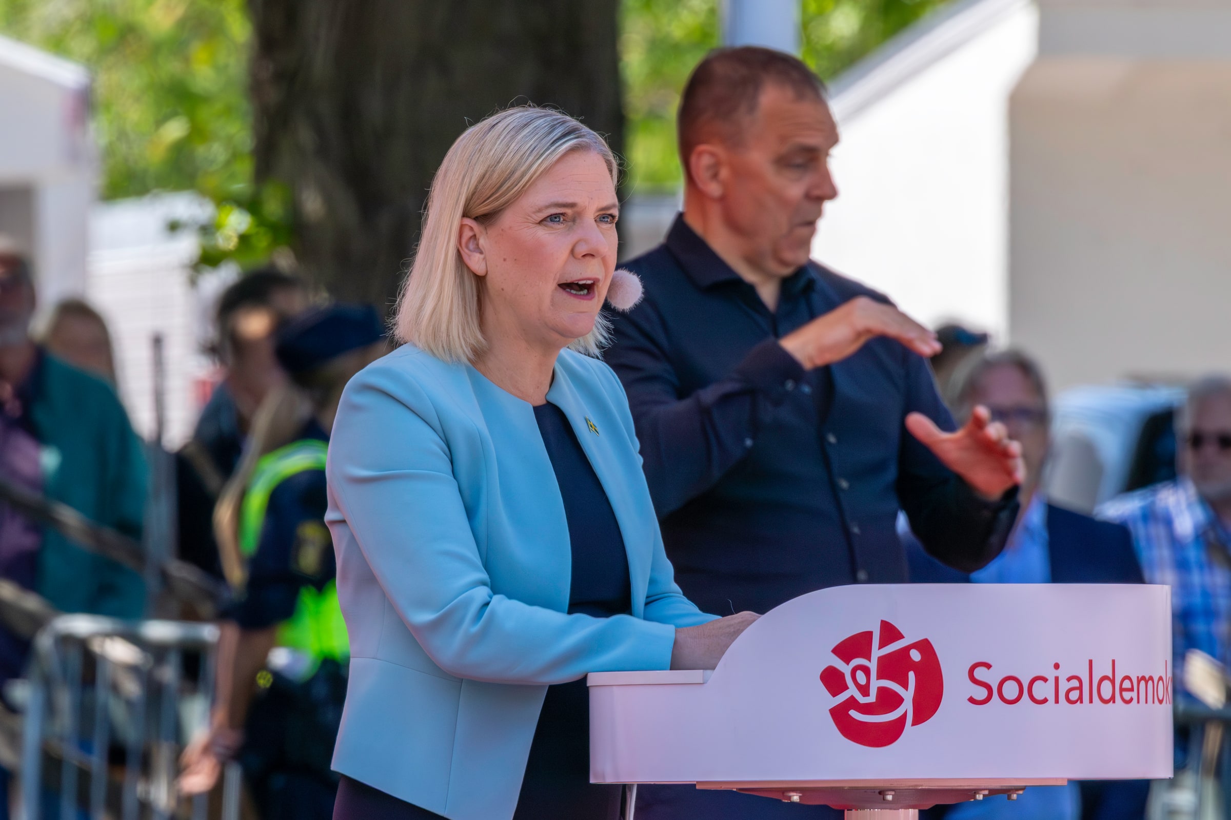 Social Democratic leader Magdalena Andersson speaks with a sign language interpreter at Almedalen Week in June 2025.