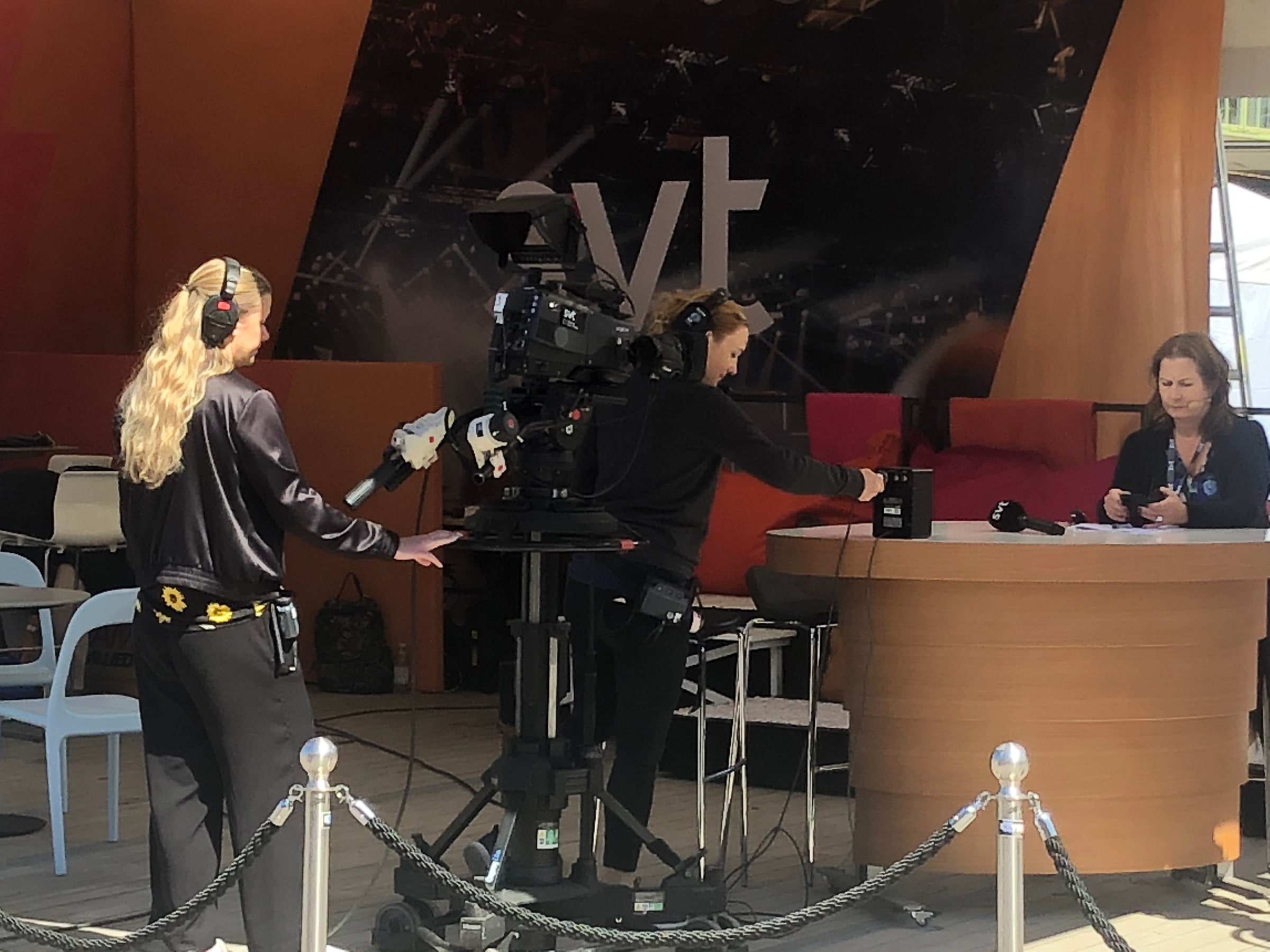 Two SVT camera operators prepare a television studio at Almedalen Week in Visby.