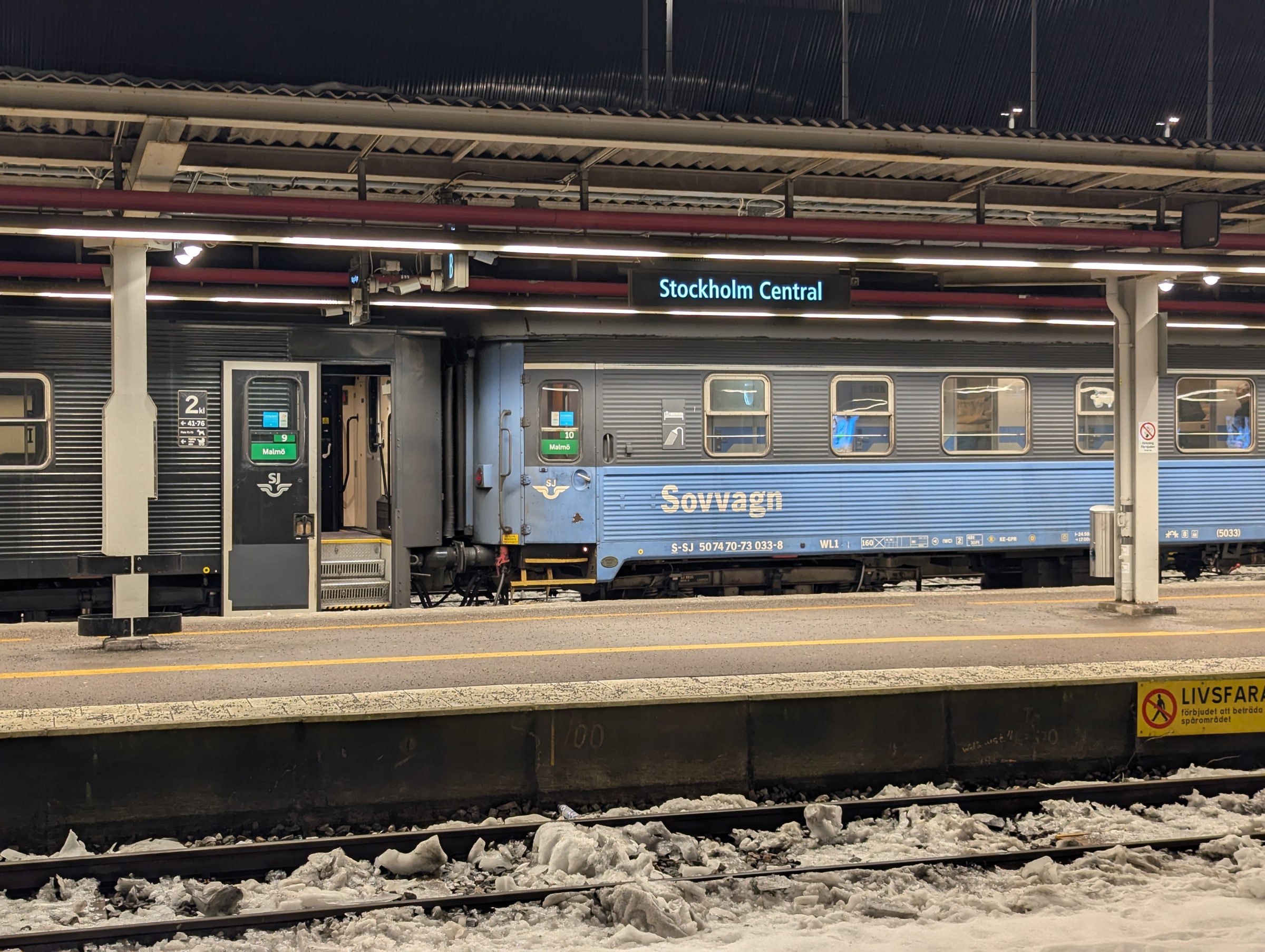 An SJ night train stands at Stockholm Central station.