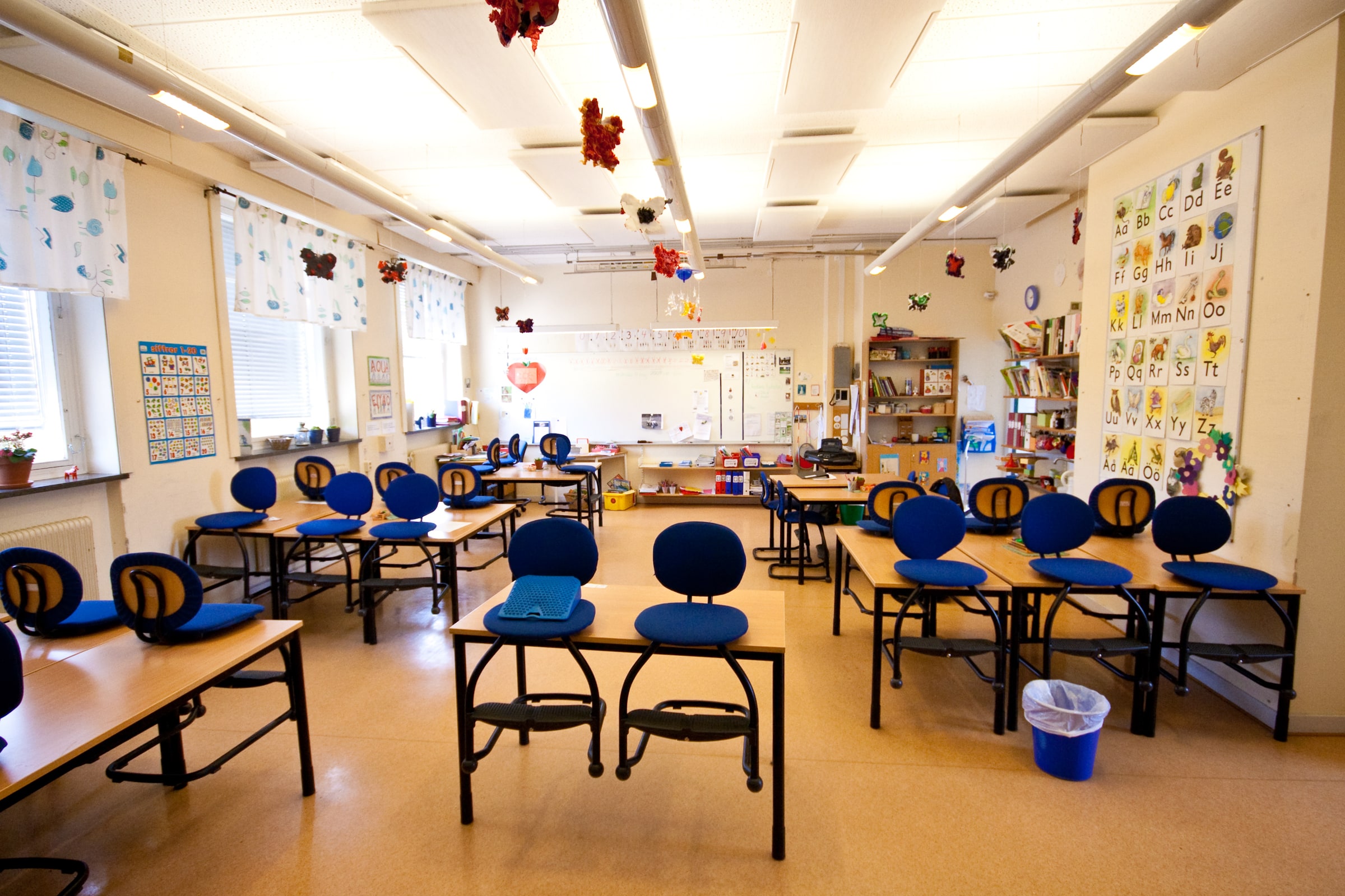An empty classroom with rows of desks and chairs in Tollarp, Sweden.