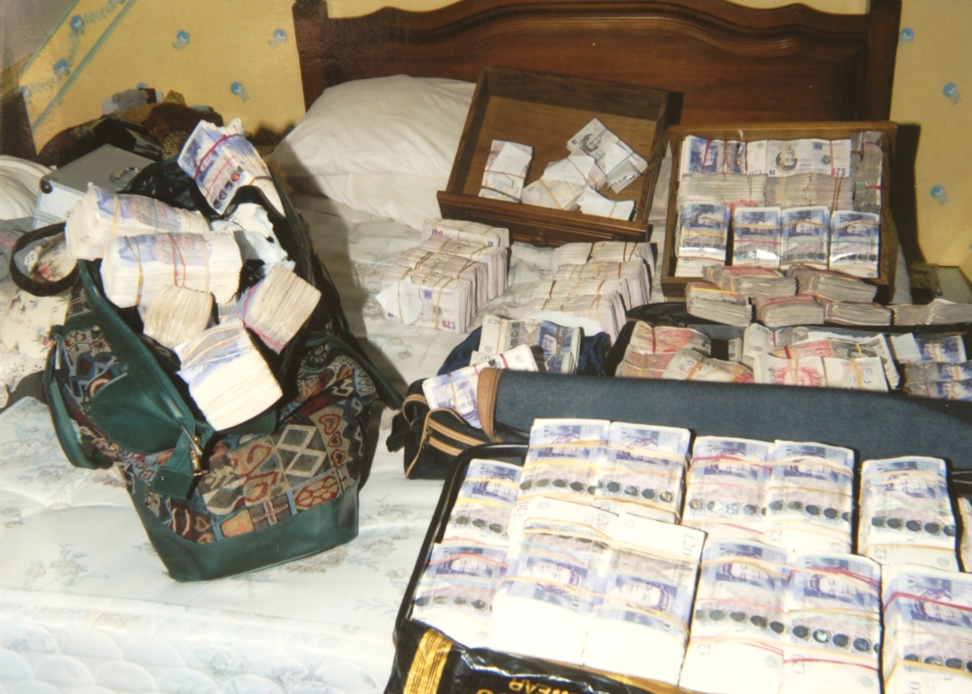 Bundles of cash laid out after being seized by economic-crime officers.