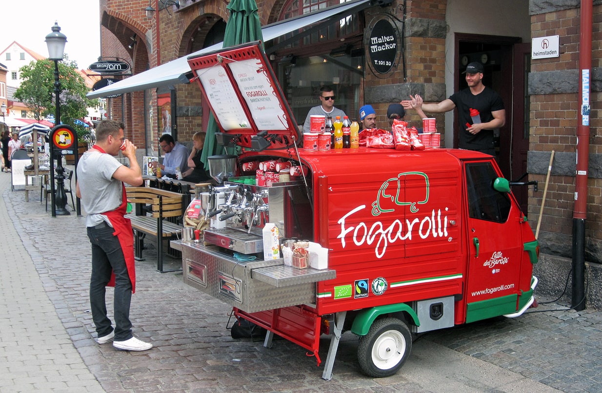 A barista works at a mobile espresso bar in central Ystad in 2013.
