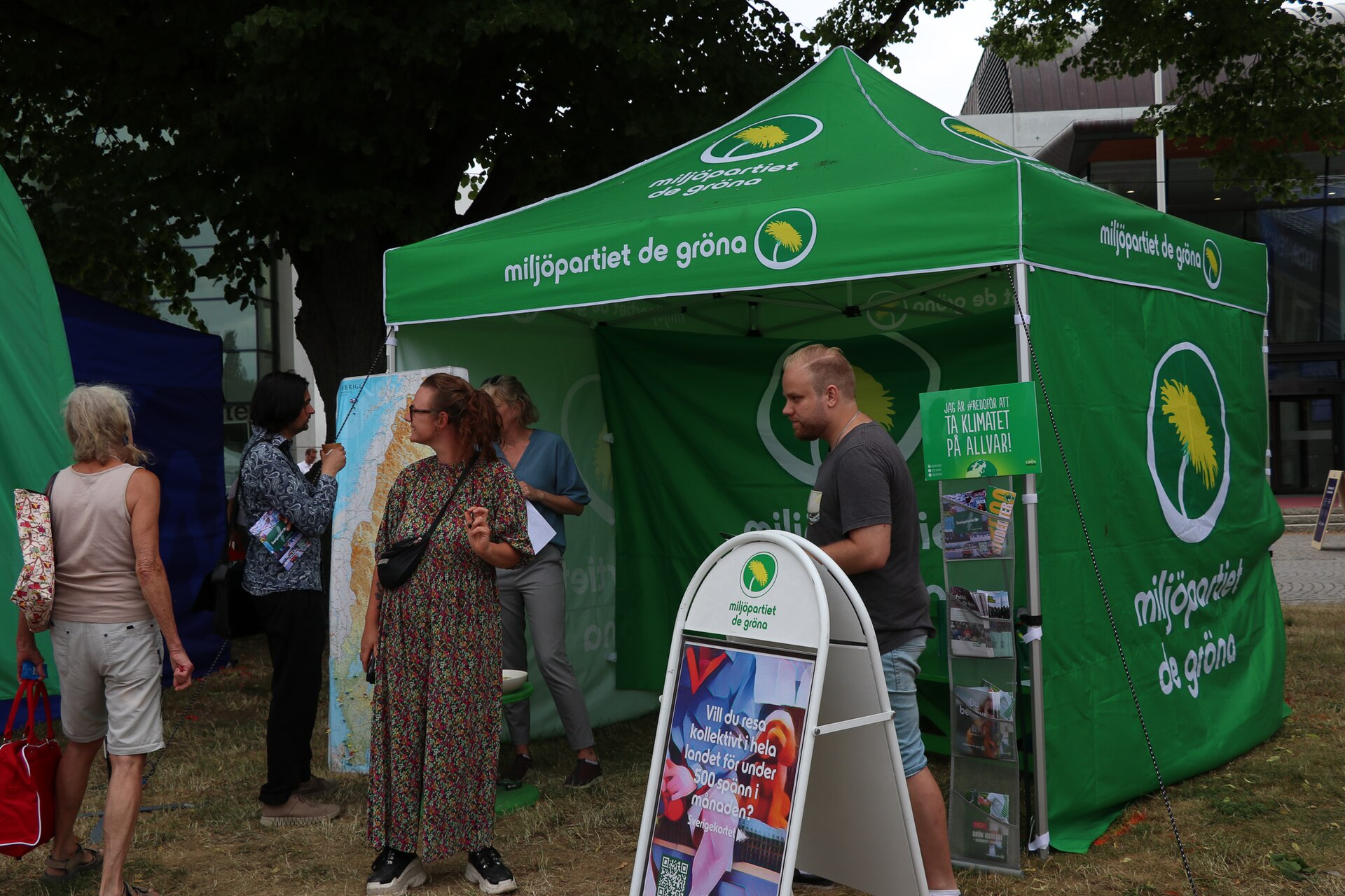 People visit the Green Party's public political tent during Almedalen Week in 2023.