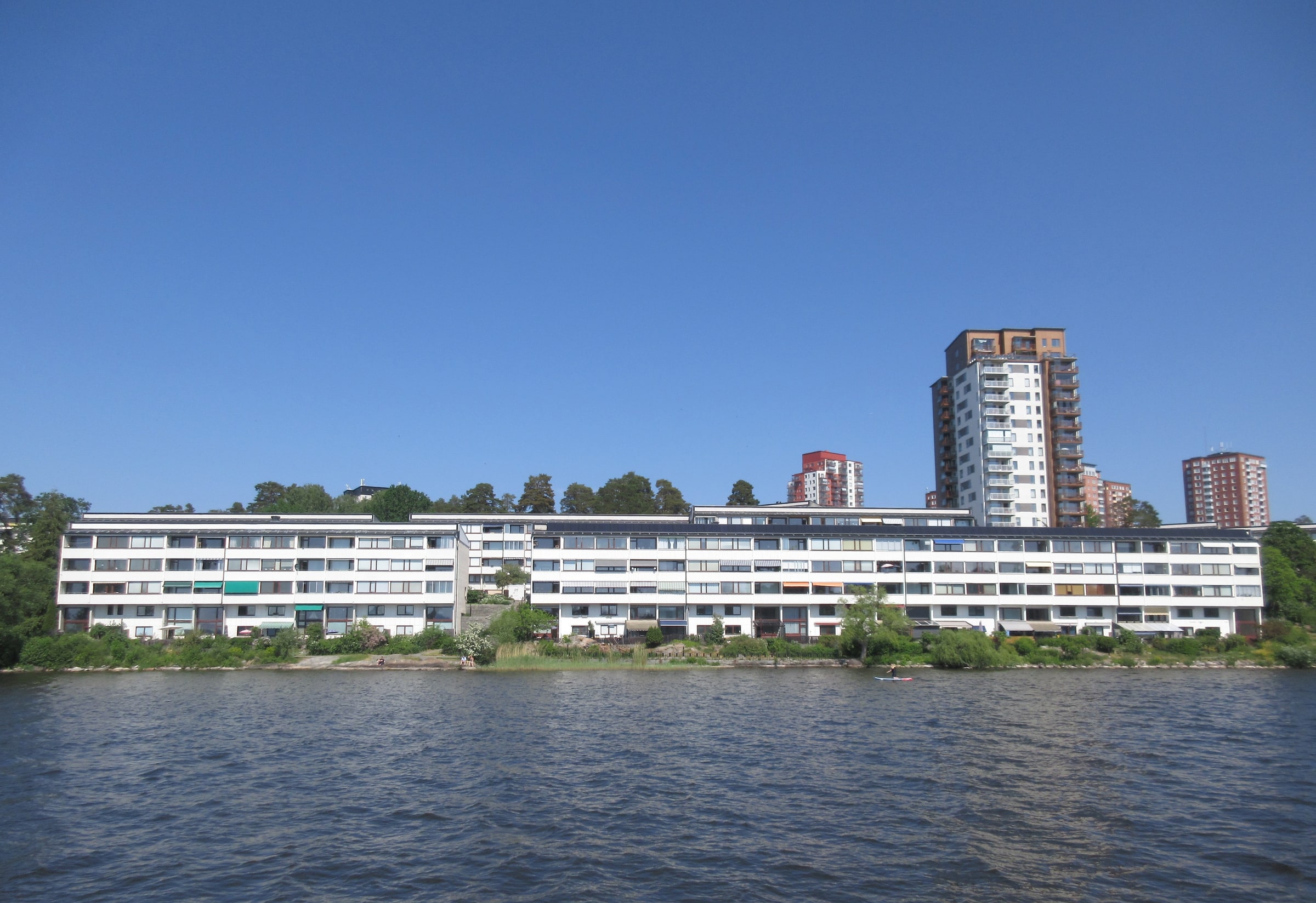 Long apartment blocks at Strandliden in Hässelby Strand, with taller housing behind