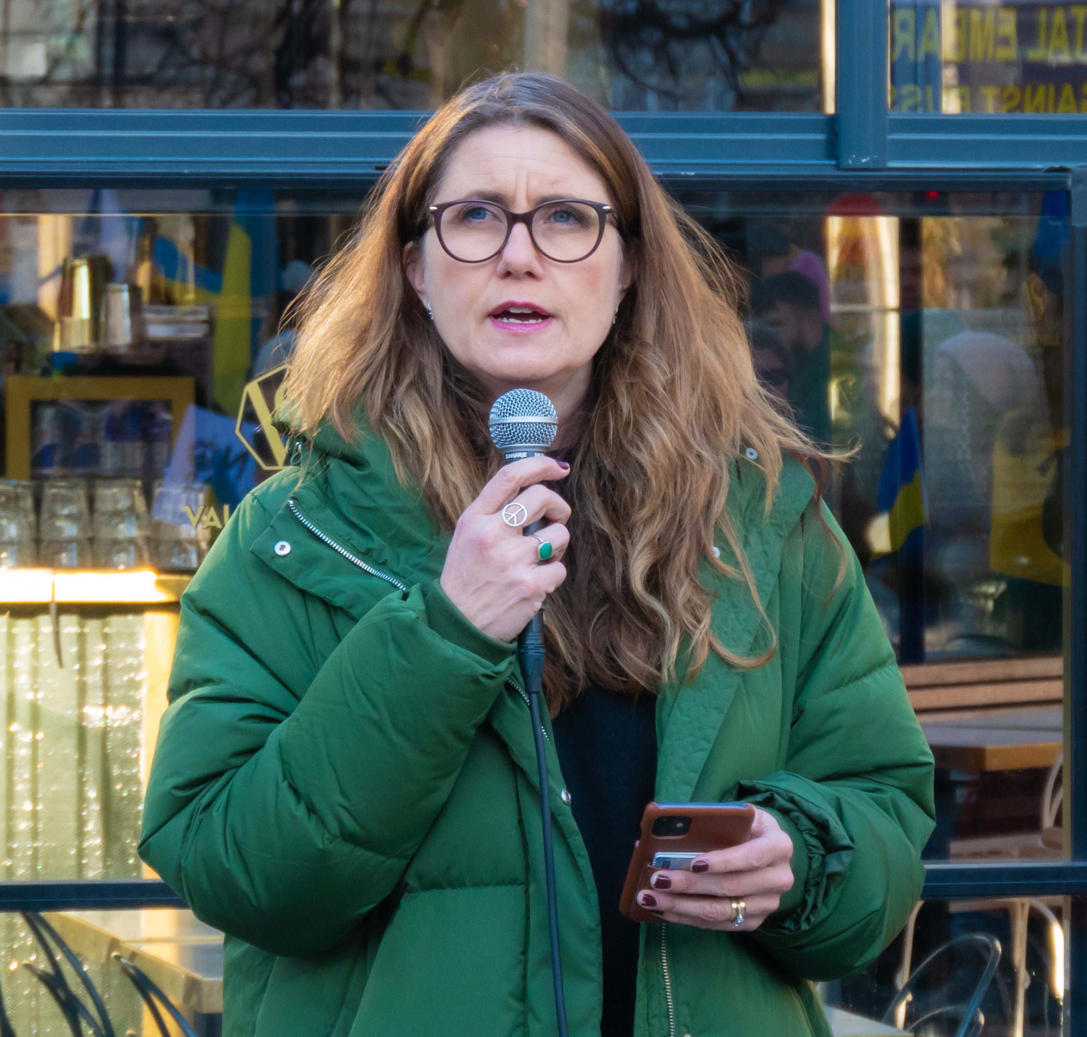 Janine Alm Ericson speaking at a demonstration in Stockholm in February 2022.