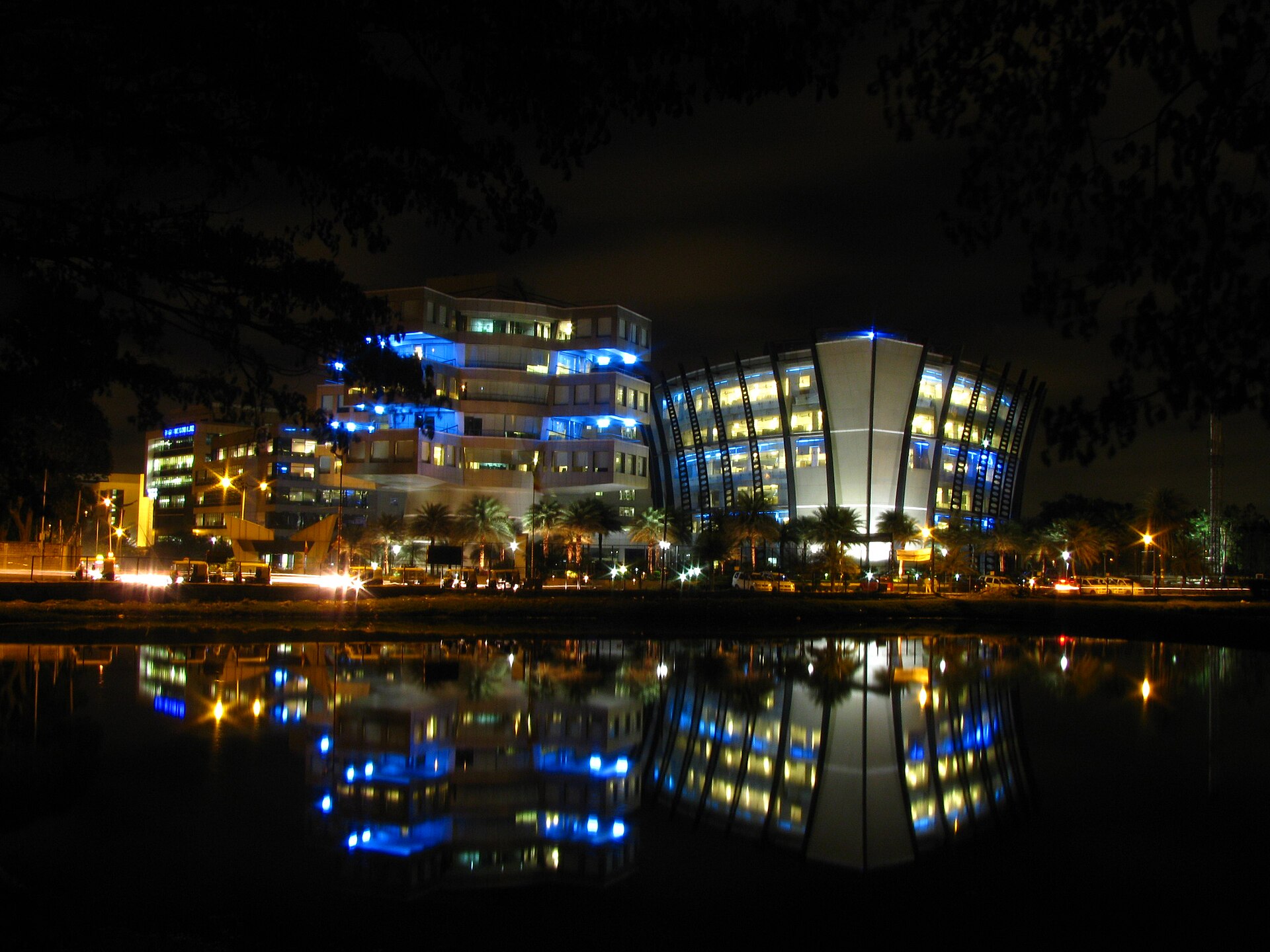 Office buildings reflected at night in Bagmane Tech Park in Bengaluru