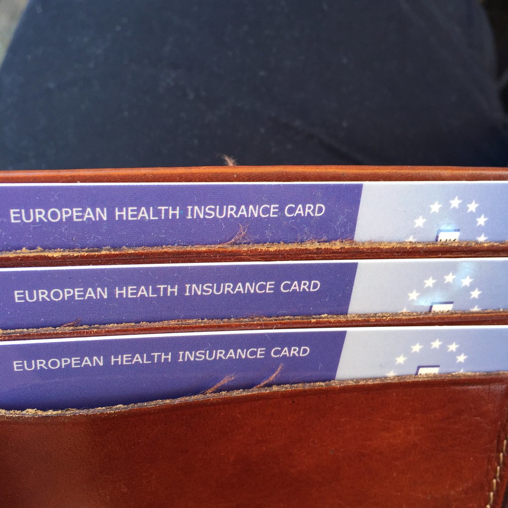 European Health Insurance Cards tucked into a brown leather wallet.