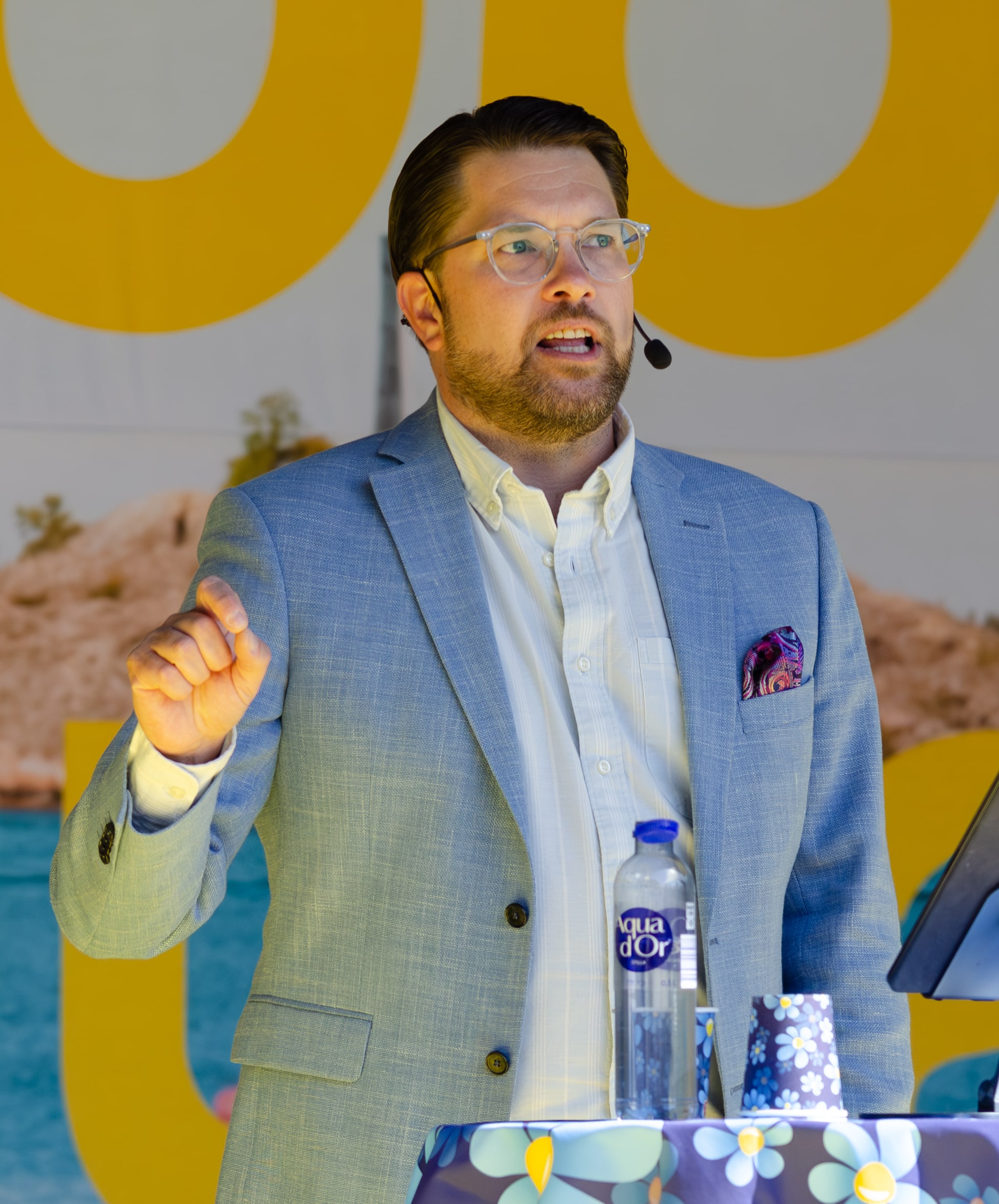 Jimmie Åkesson speaks and raises his right hand at Långholmen, Stockholm, on 4 May 2024.