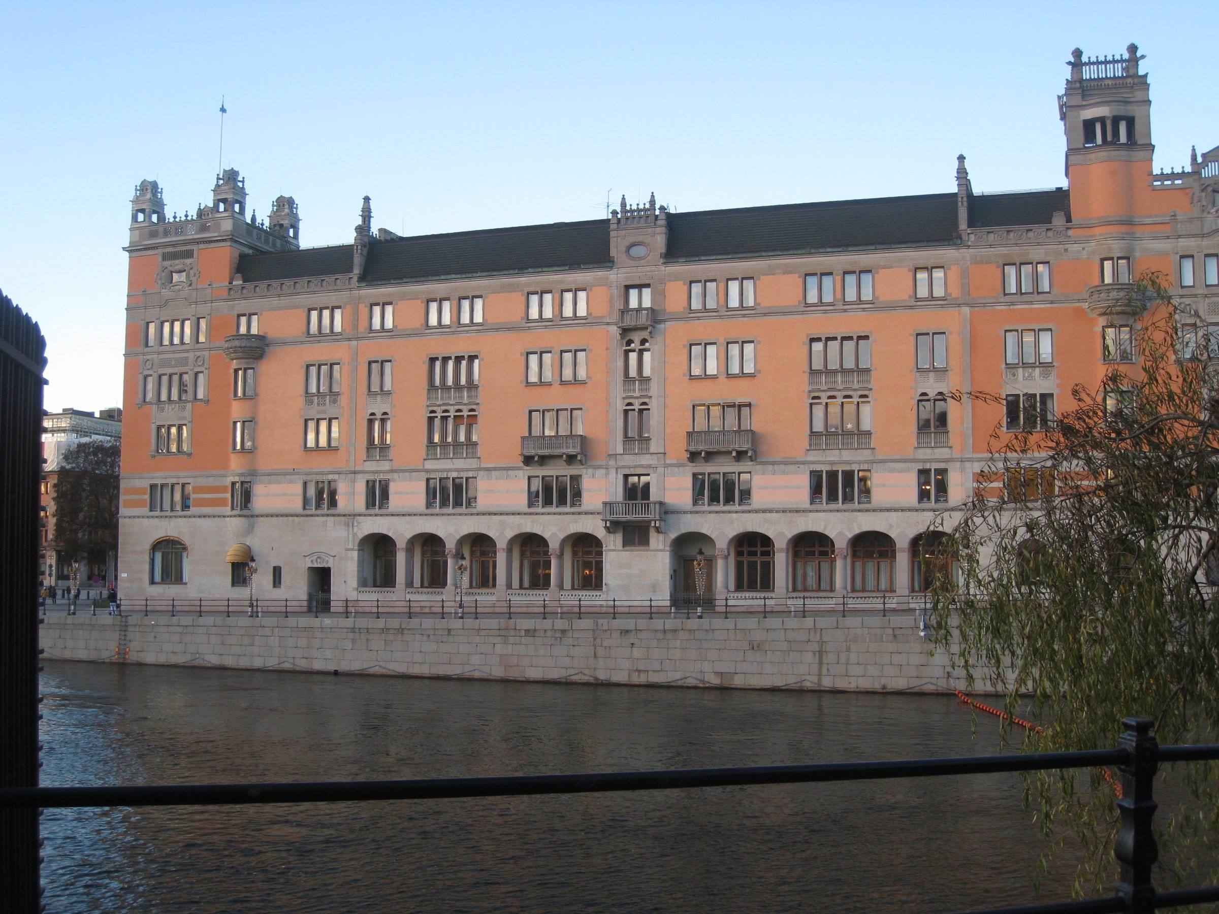 Rosenbad's orange facade and arched ground-floor windows beside the water in central Stockholm.