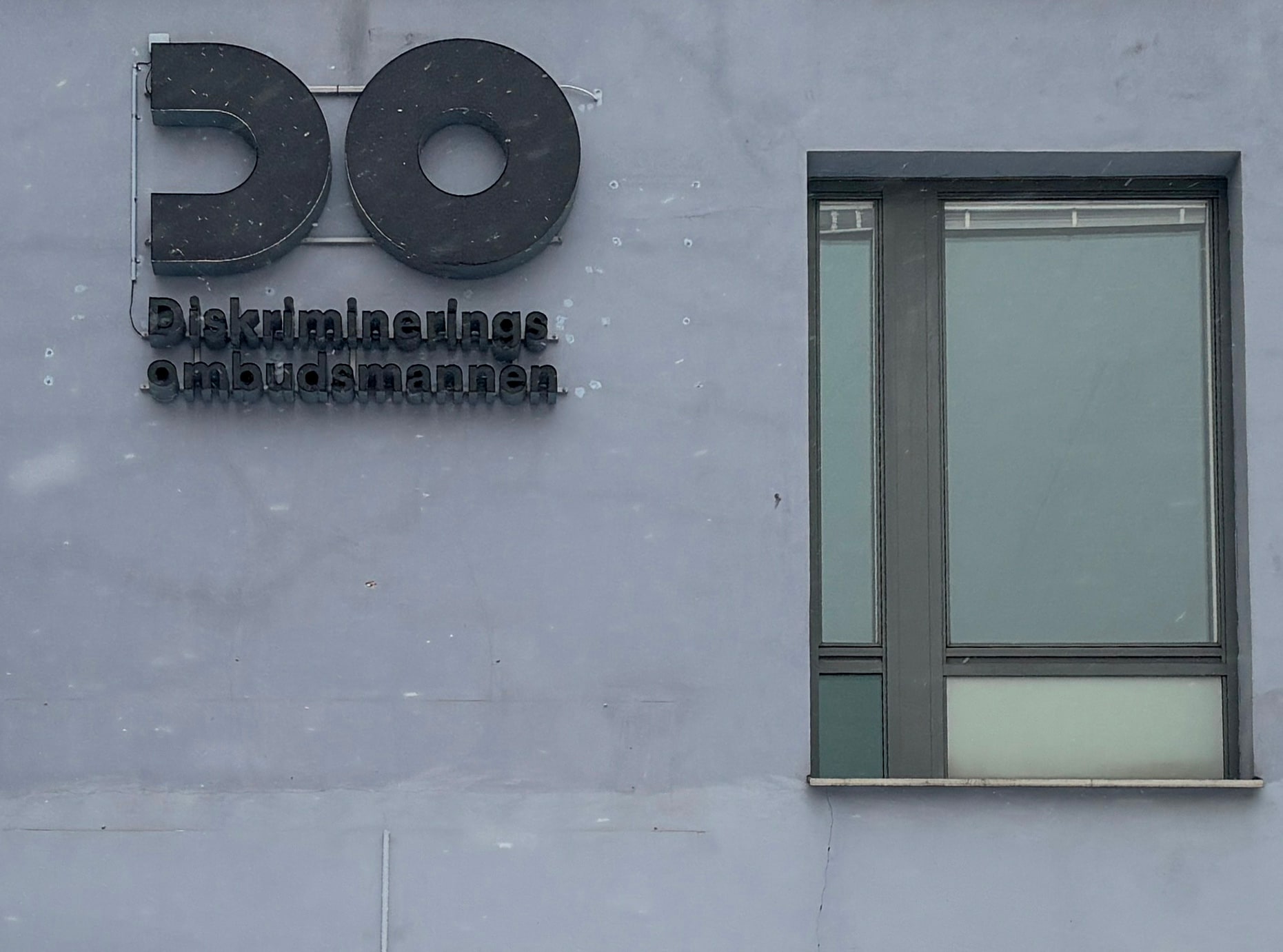 The Discrimination Ombudsman's sign on an office wall in Solna.