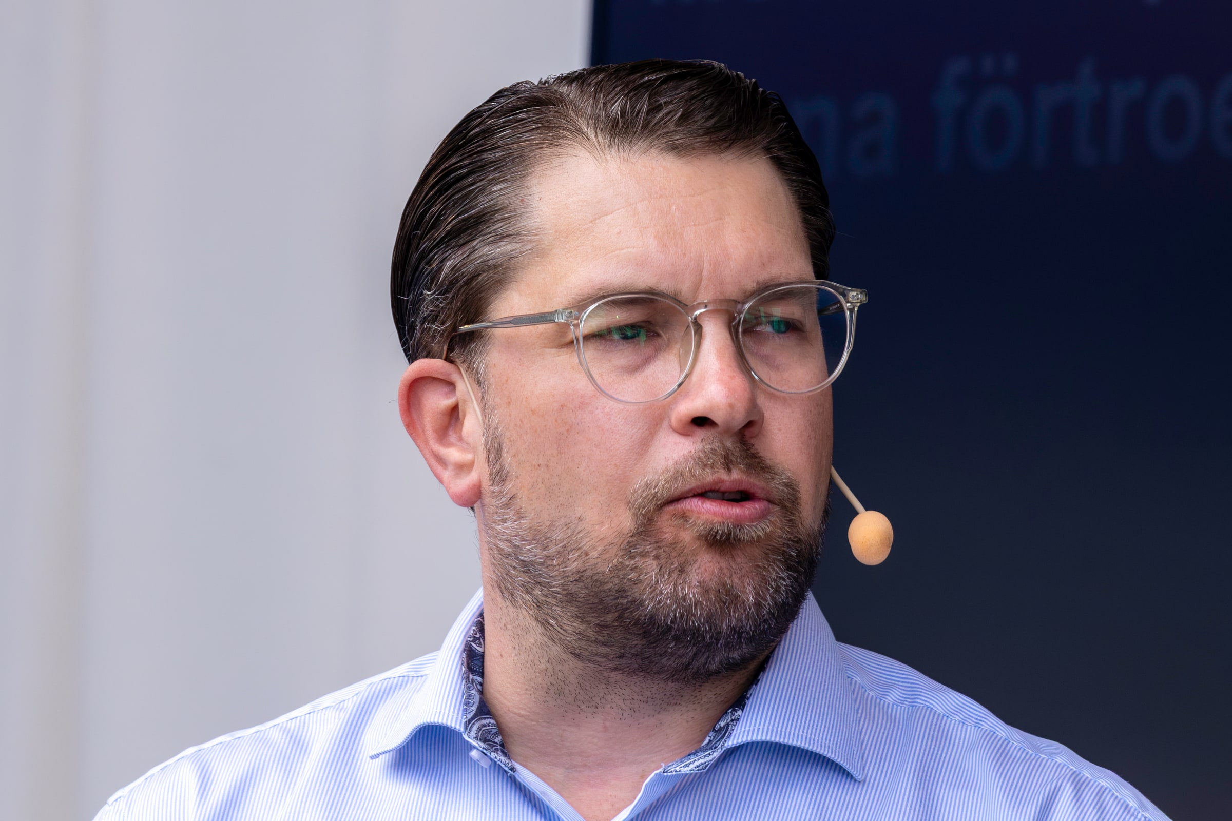 Jimmie Åkesson, leader of the Sweden Democrats, speaks with a headset microphone at Almedalen Week in June 2026.