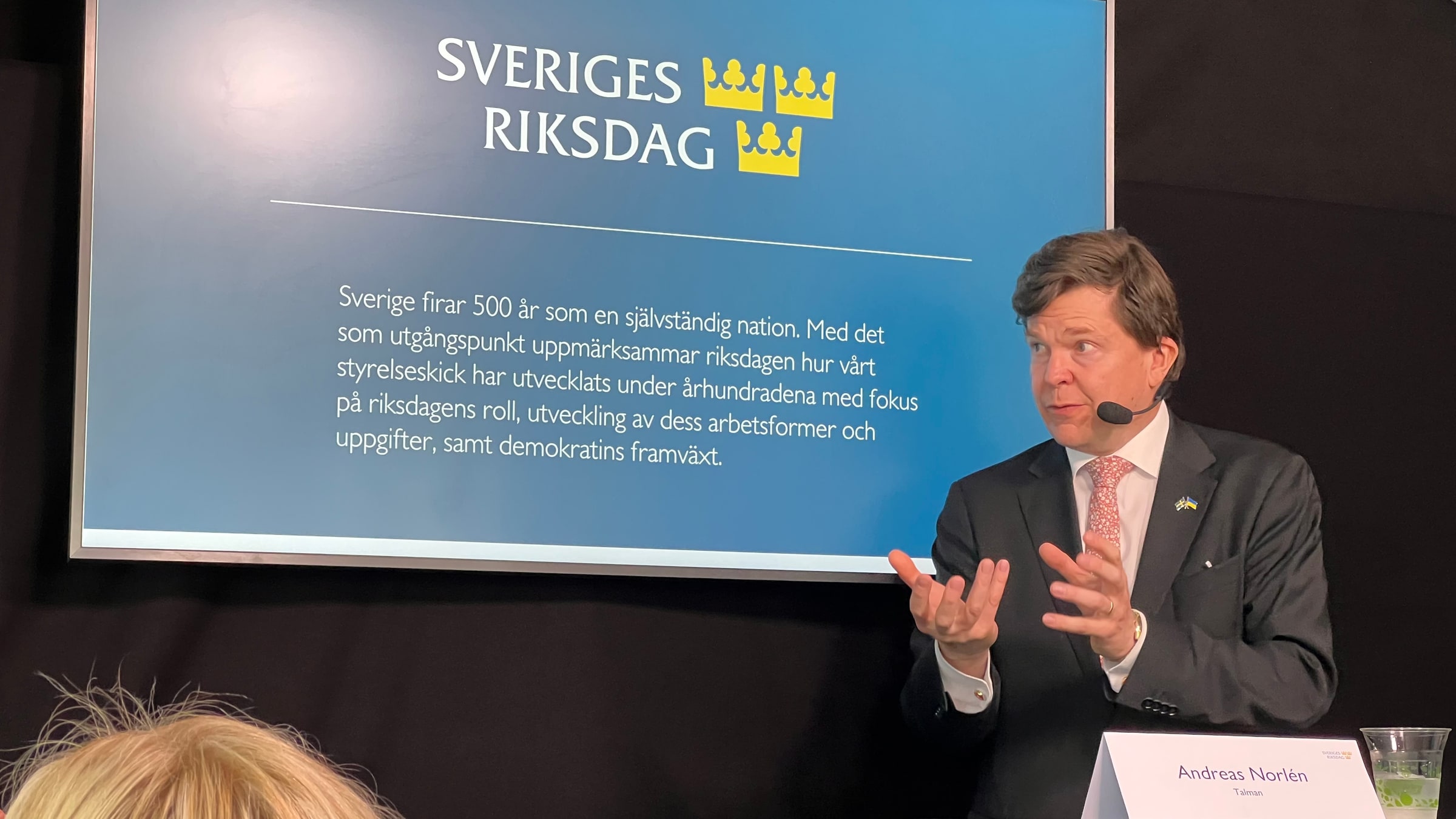 Andreas Norlén speaks at a Riksdag presentation during Almedalen in June 2023.