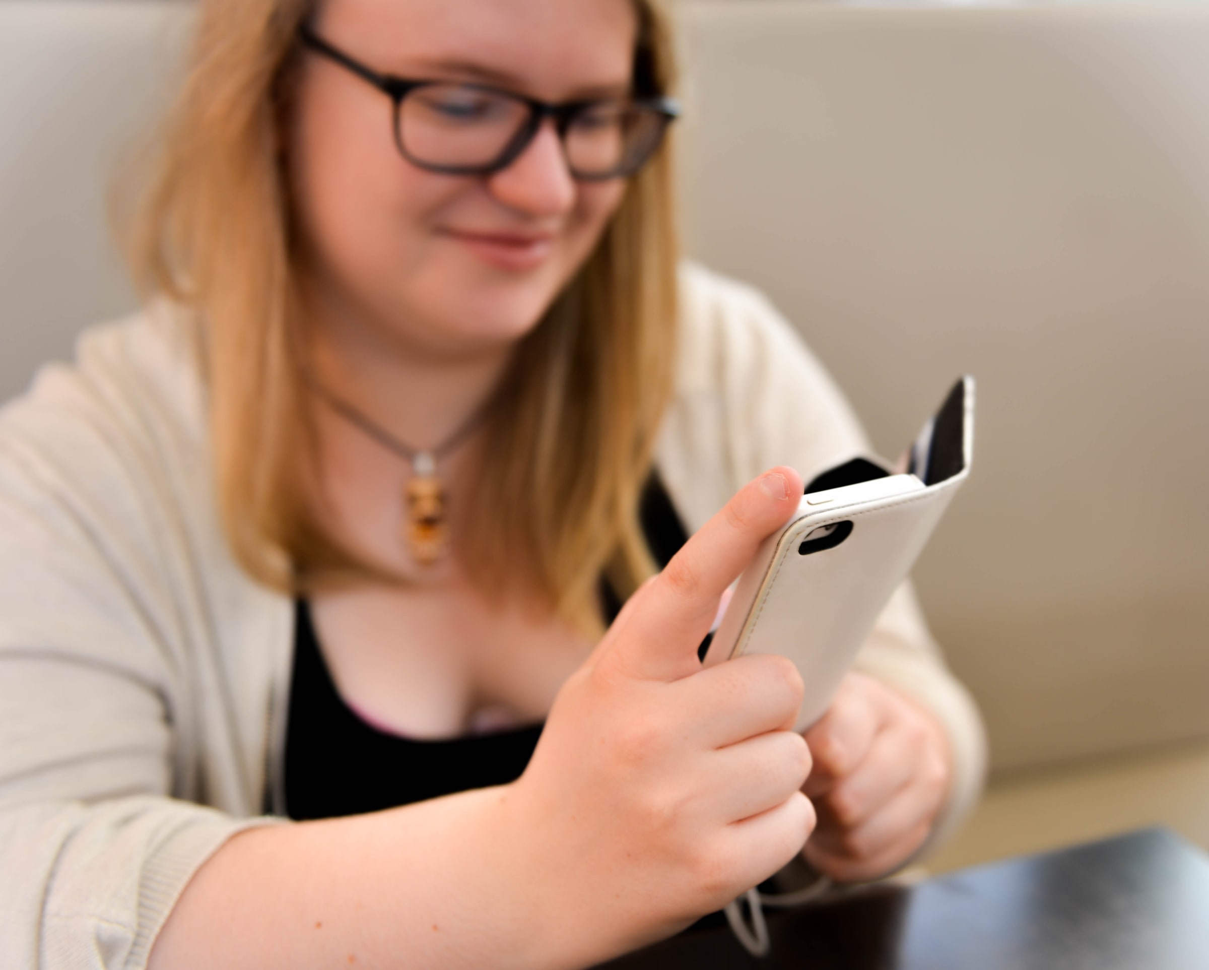 A woman uses a smartphone in Tyresö, Sweden, in August 2016.