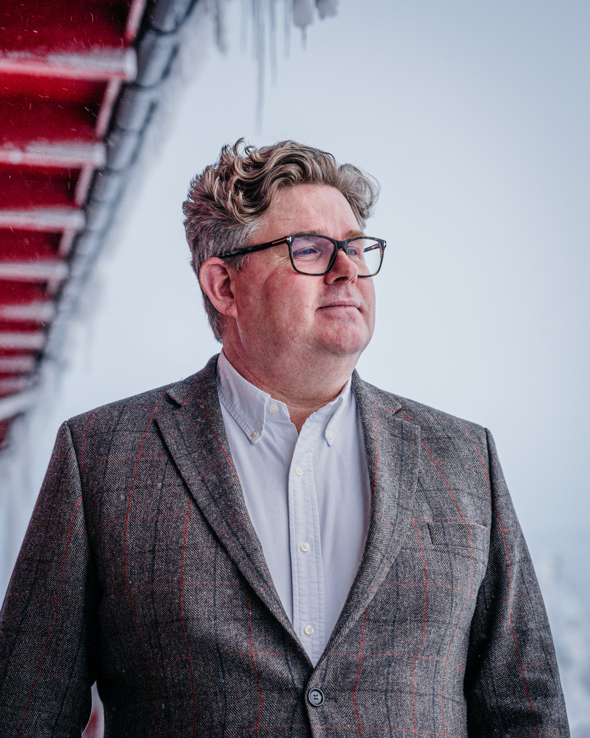 Justice Minister Gunnar Strömmer wears glasses and a grey checked jacket in a January 2023 portrait.