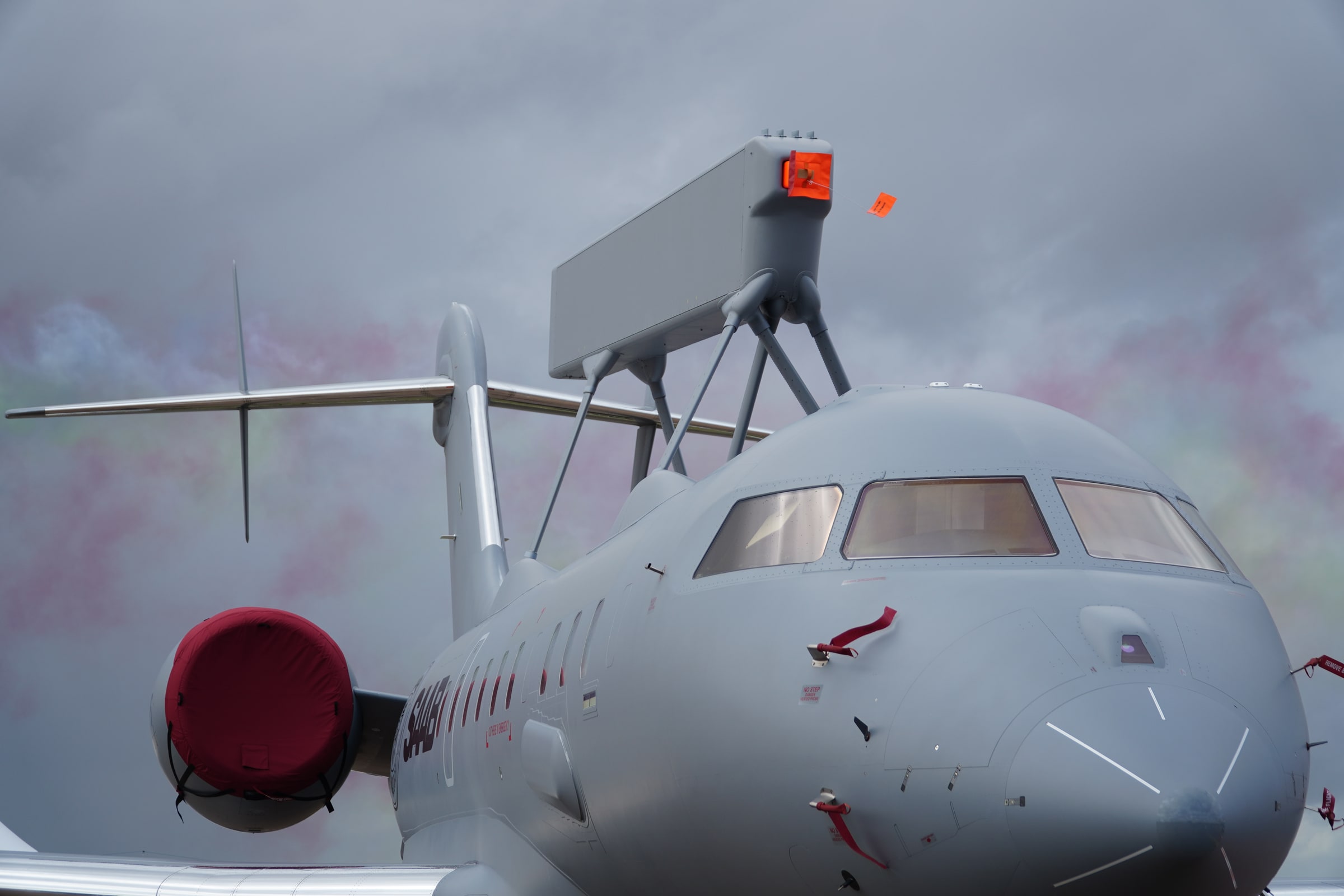 A Saab GlobalEye surveillance aircraft with its large radar mounted above the fuselage.