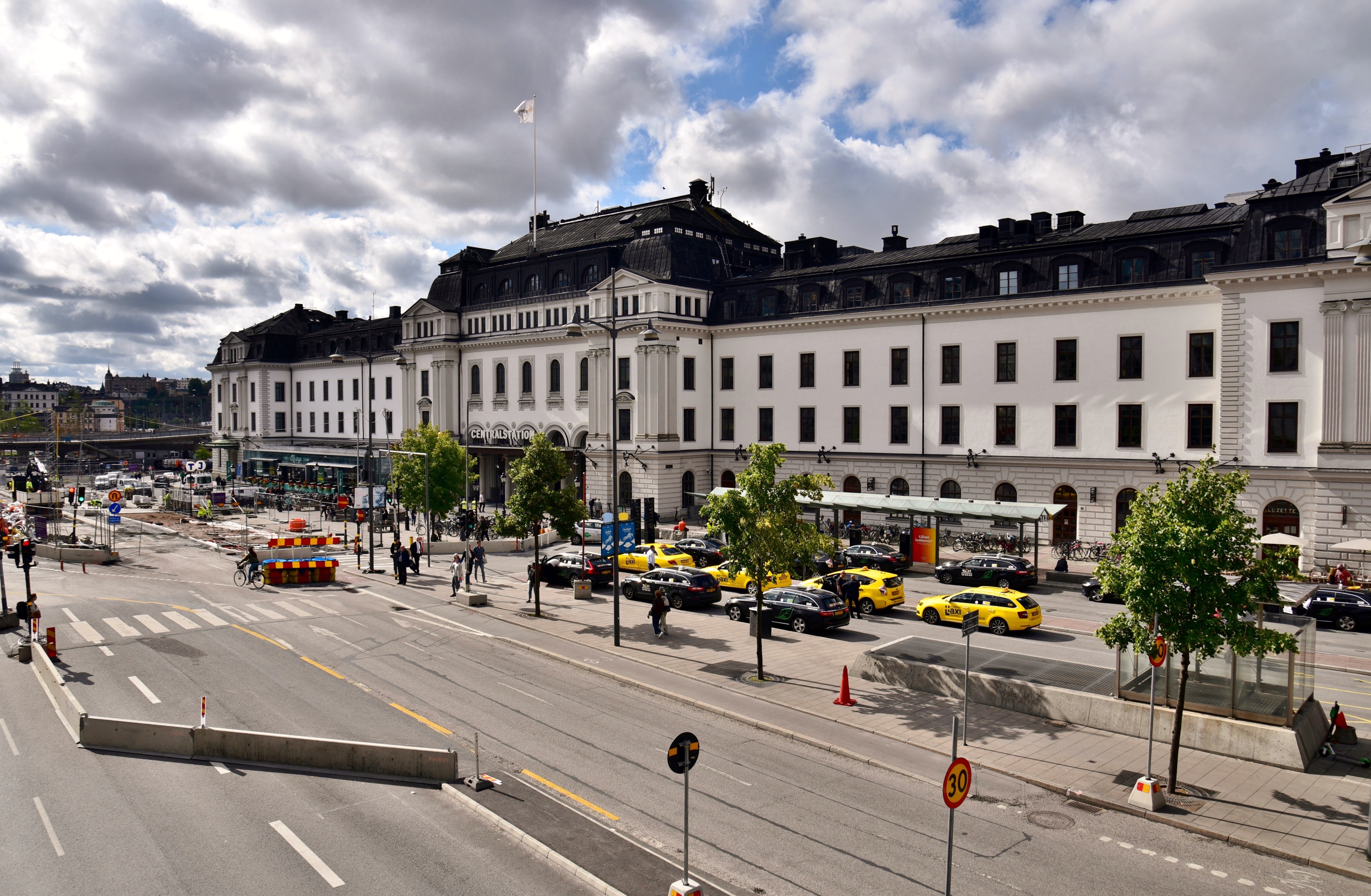 The main building of Stockholm Central Station seen across the station forecourt on an August day.