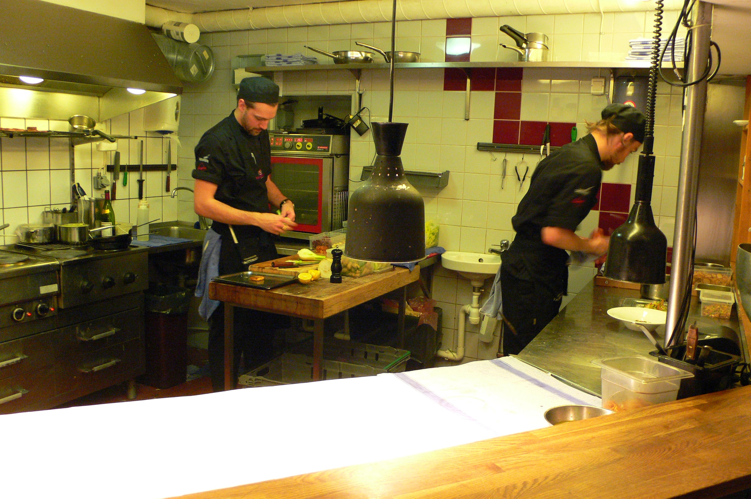 Chefs preparing food in the kitchen at Basement in Gothenburg in December 2011.