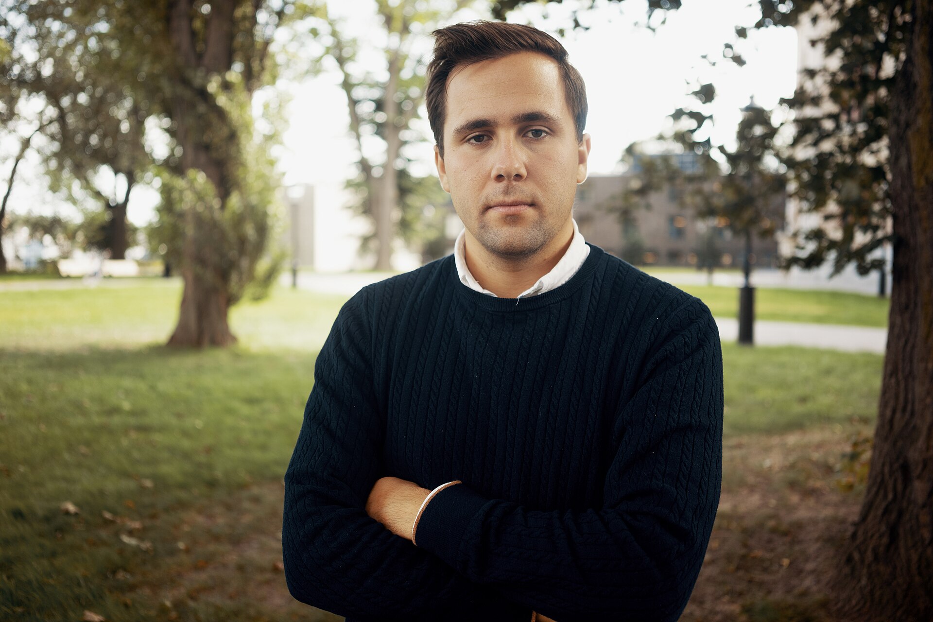 Swedish development minister Benjamin Dousa standing outdoors.