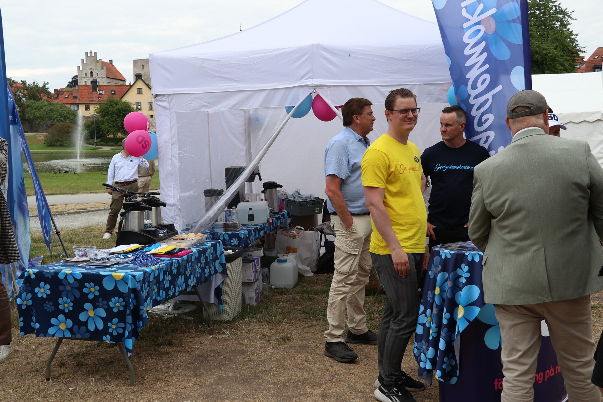 People visit the Sweden Democrats' public political tent during Almedalen Week in 2023.