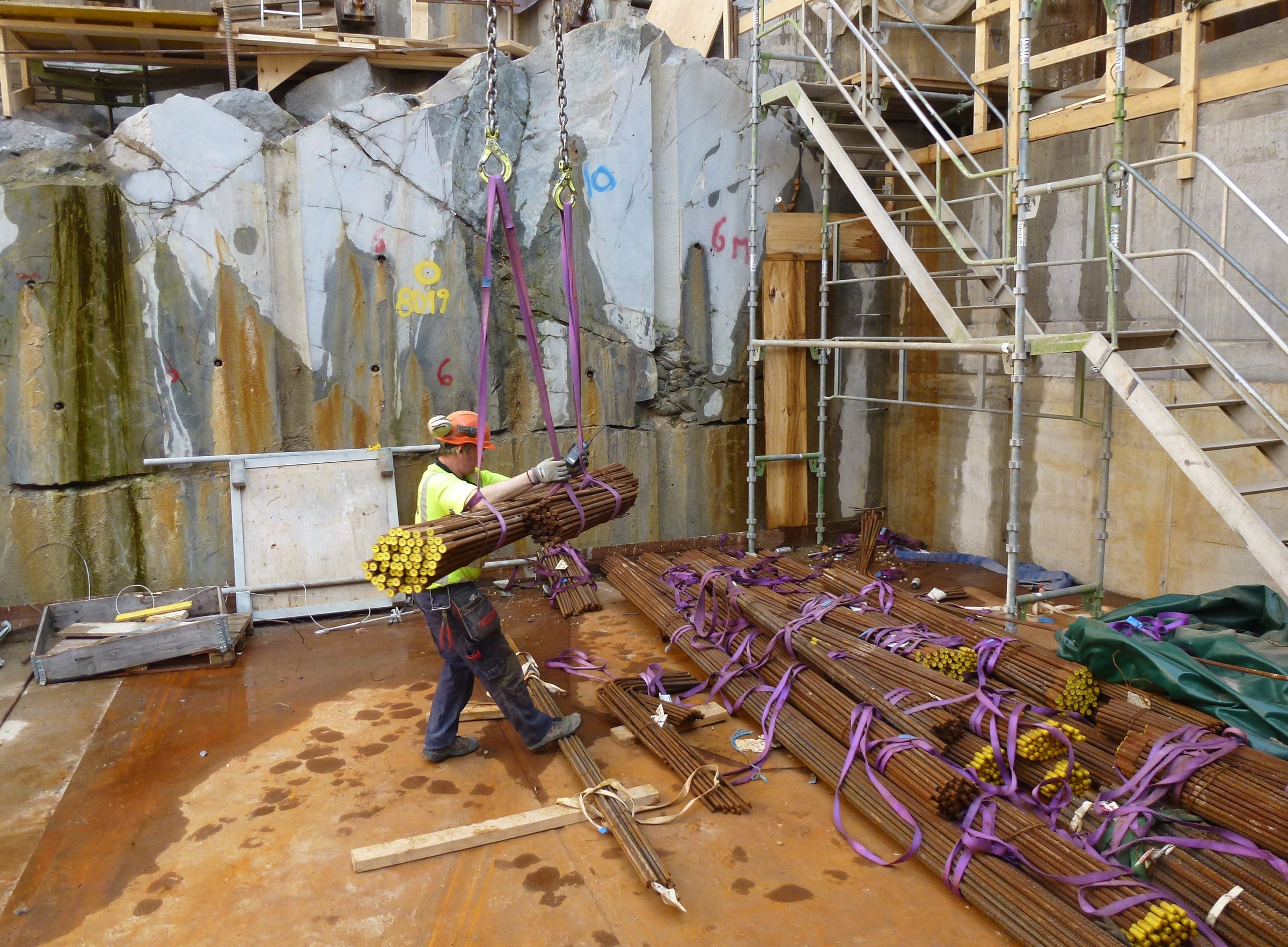 A worker guides reinforcing steel during Citybanan construction in Stockholm in April 2013.
