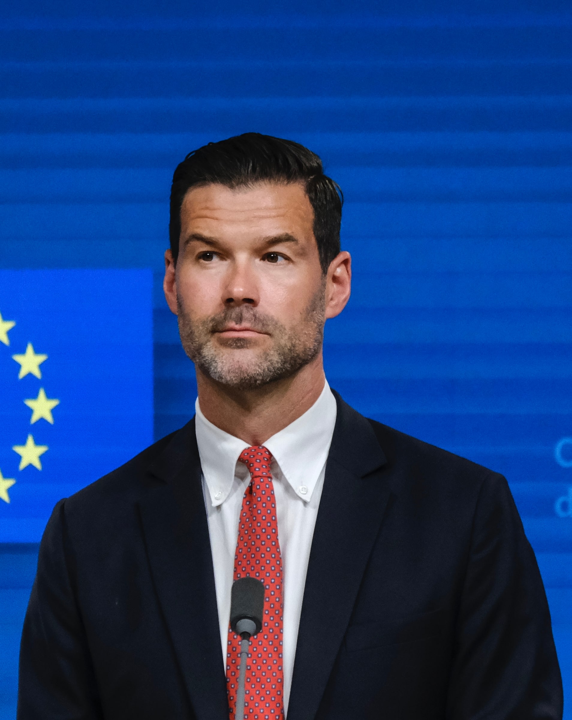 Johan Forssell at a press-conference microphone in Brussels in June 2023.