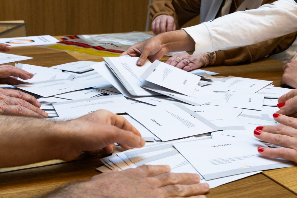 Election workers sort ballot papers in an Election Authority photograph for Sweden's 2026 elections.