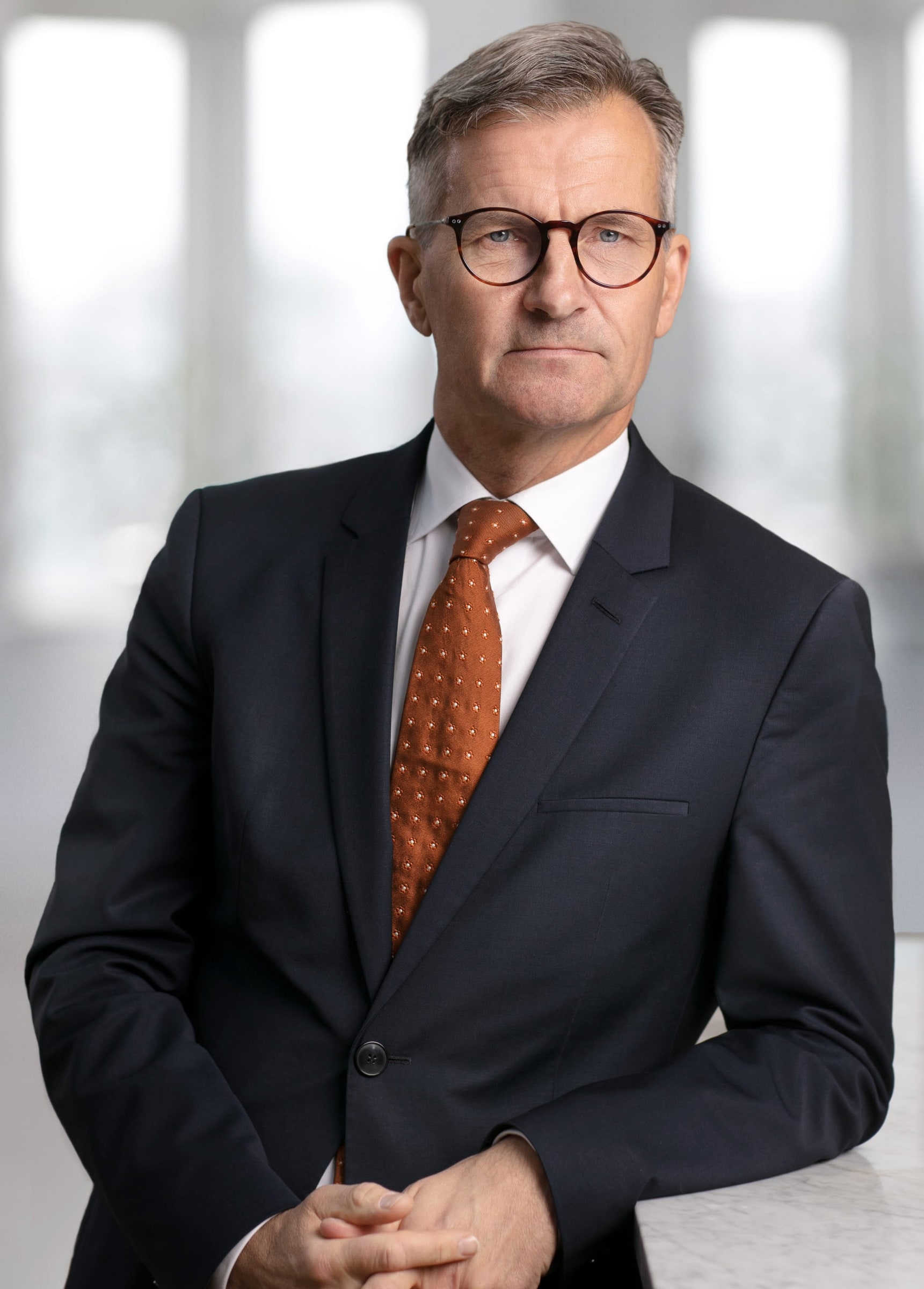 Riksbank Governor Erik Thedéen in a dark suit and brown tie.
