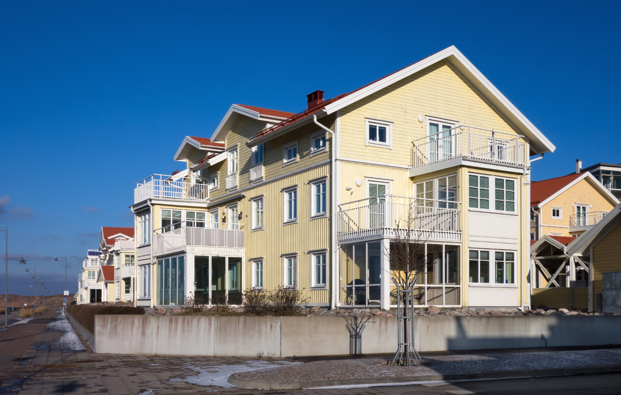 Yellow wooden villas on Norra Hamngatan in Lysekil, Sweden.