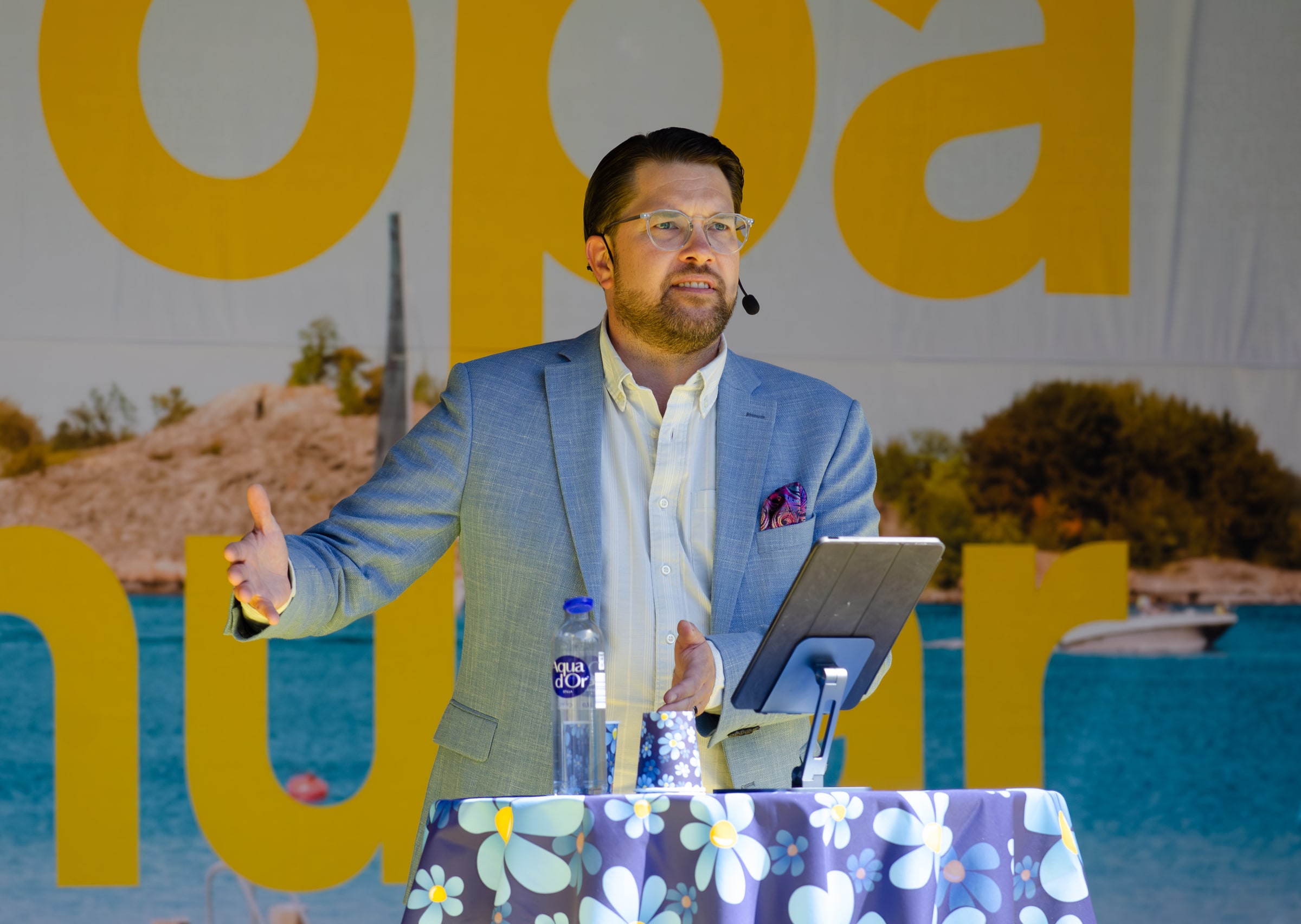 Jimmie Åkesson speaking with a headset microphone at Långholmen in Stockholm on 4 May 2024.