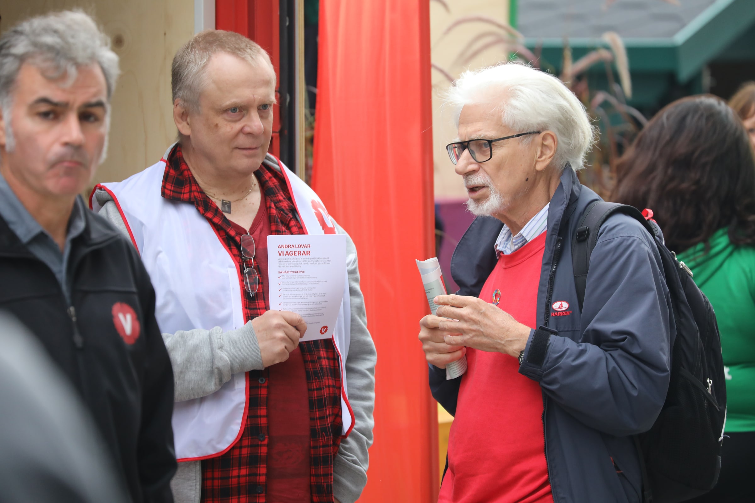 Left Party campaigners talk with voters at Sergels torg before Sweden's 2022 election.