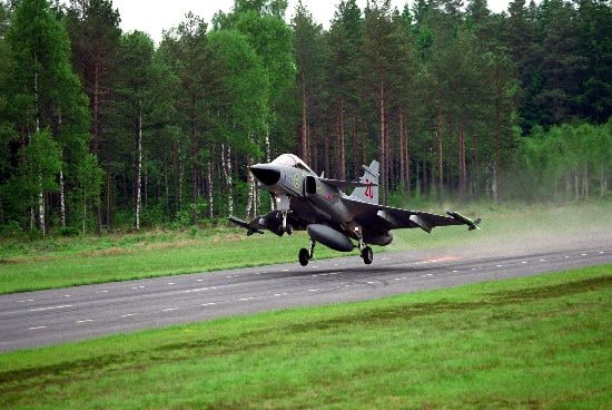 A Swedish Air Force Gripen takes off from a short runway on a public road in 2010.