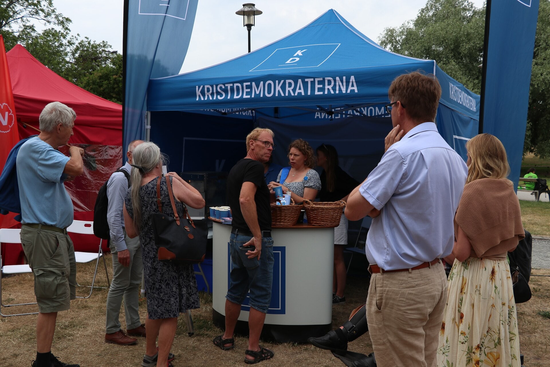 People visit the Christian Democrats' public political tent during Almedalen Week in 2023.