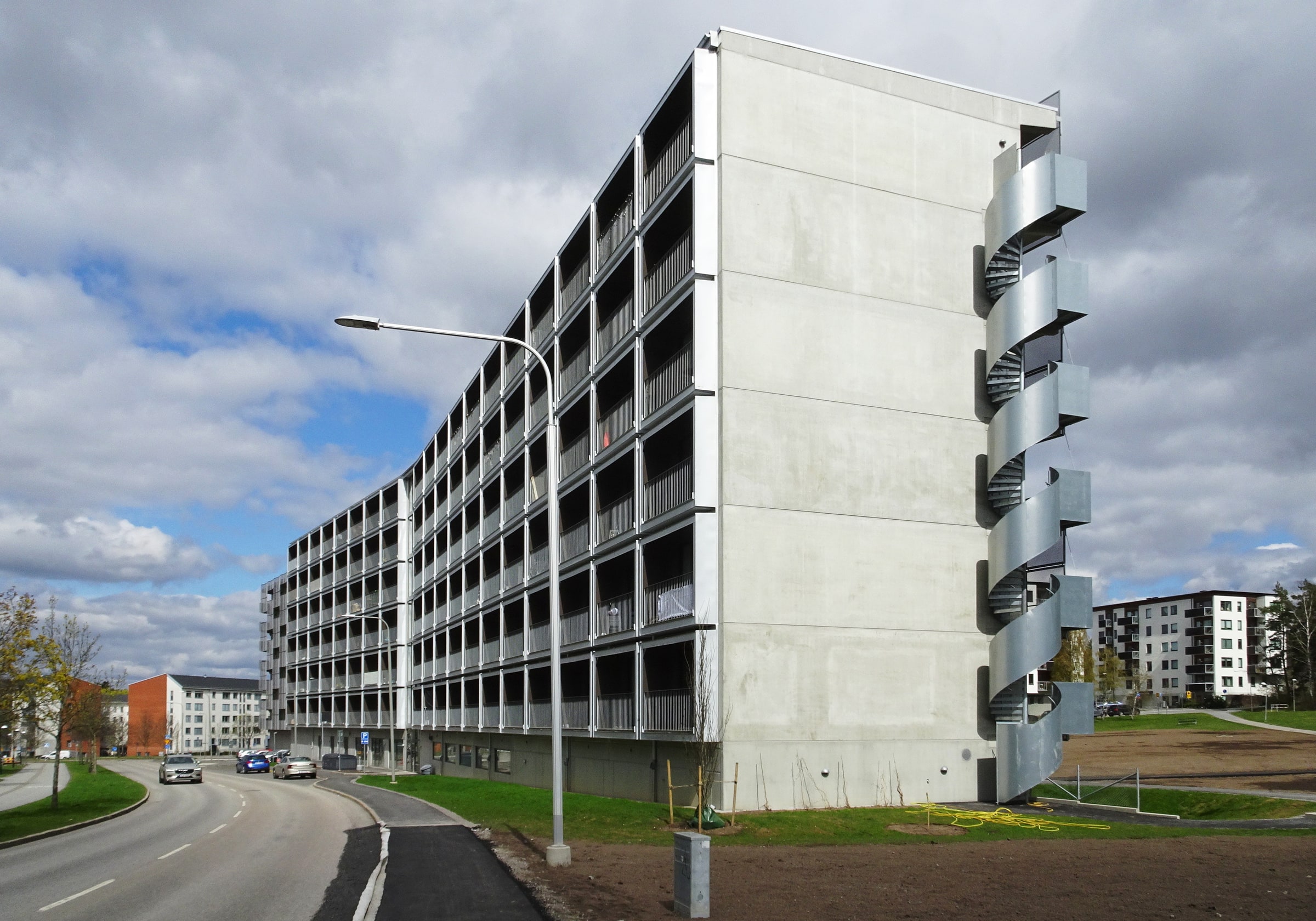 Svenska Bostäder’s Snabba Hus rental building in Råcksta, with rows of balconies and an exterior spiral staircase.