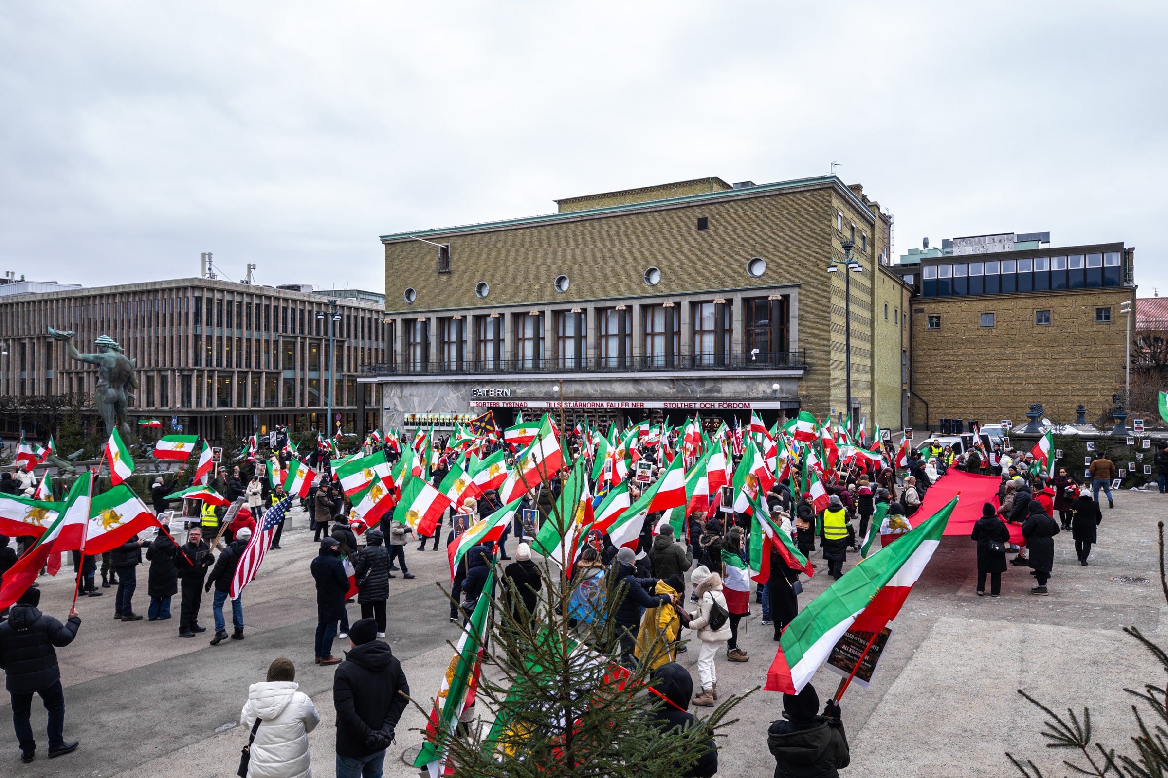 People holding flags and placards at an anti-regime protest in Gothenburg on 25 January 2026.
