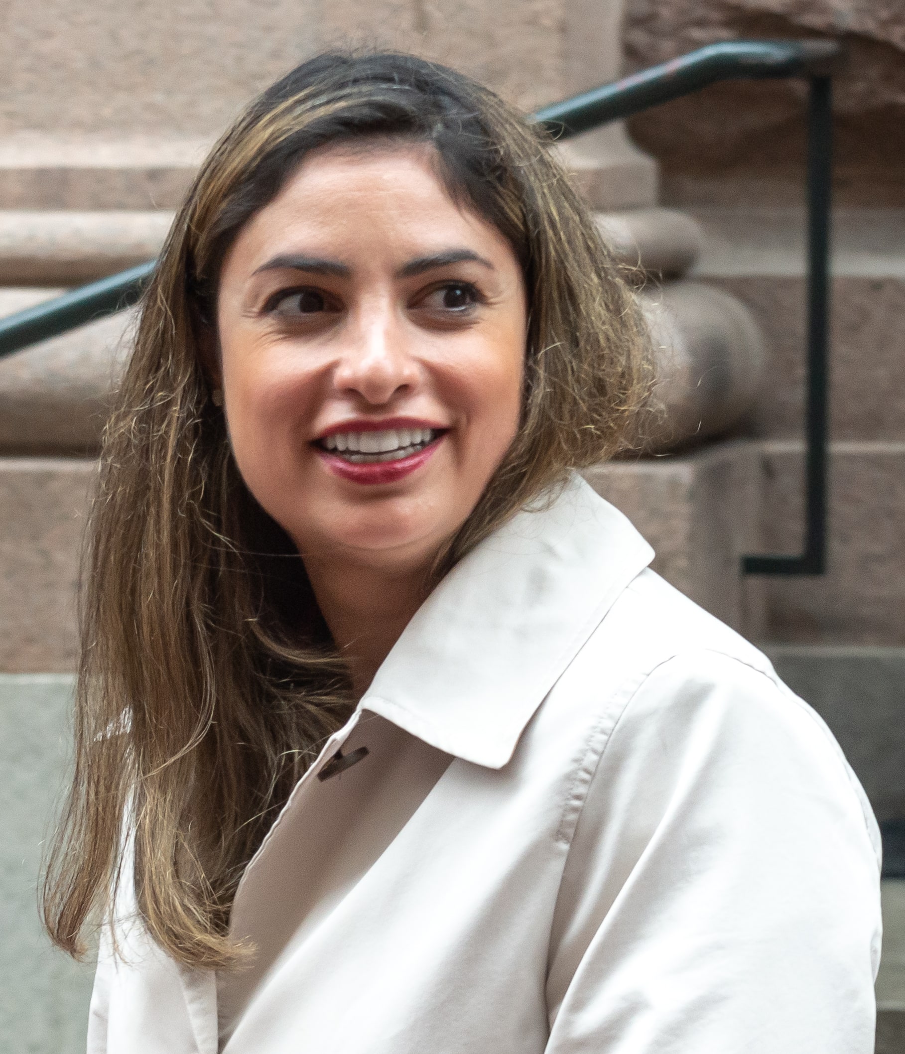 Left Party leader Nooshi Dadgostar smiles outside the Riksdag in Stockholm.