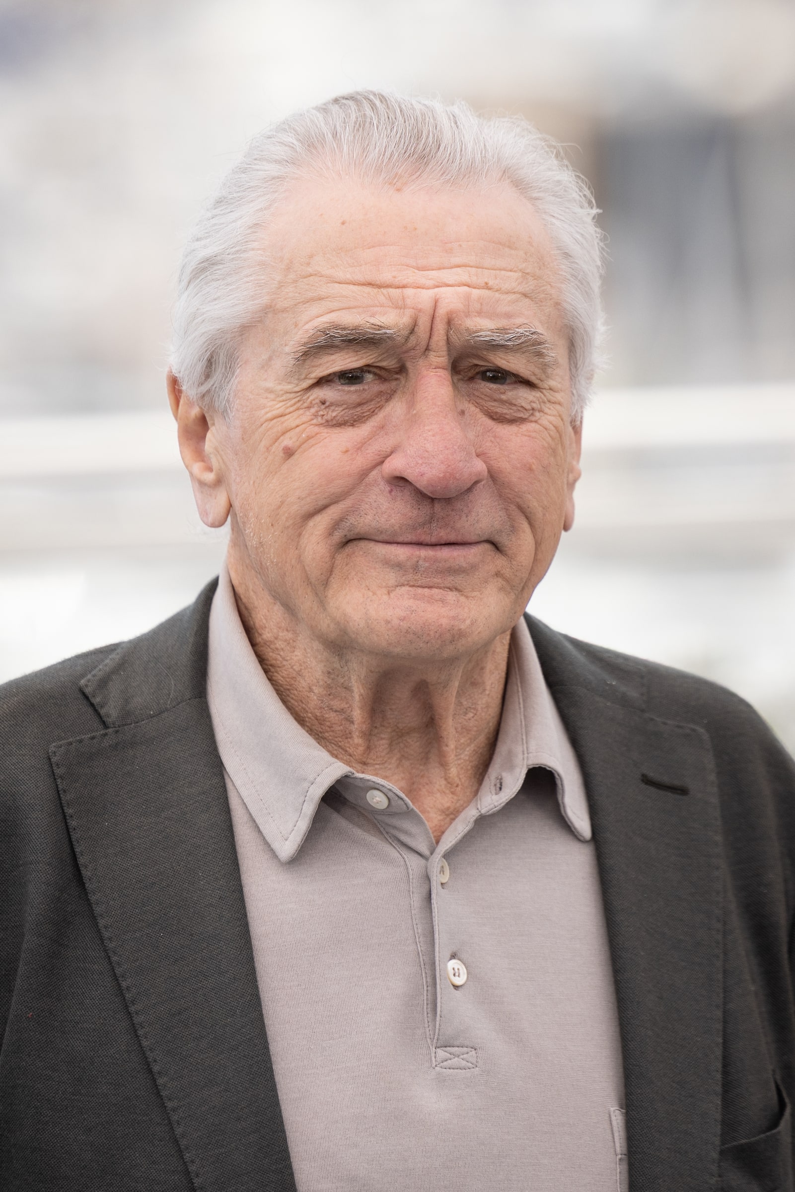Robert De Niro in a grey jacket at the Cannes Film Festival in 2025.