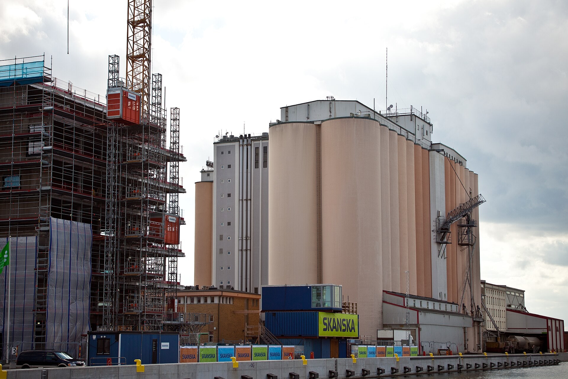 A large active construction site with cranes and partly completed structures in Malmö.