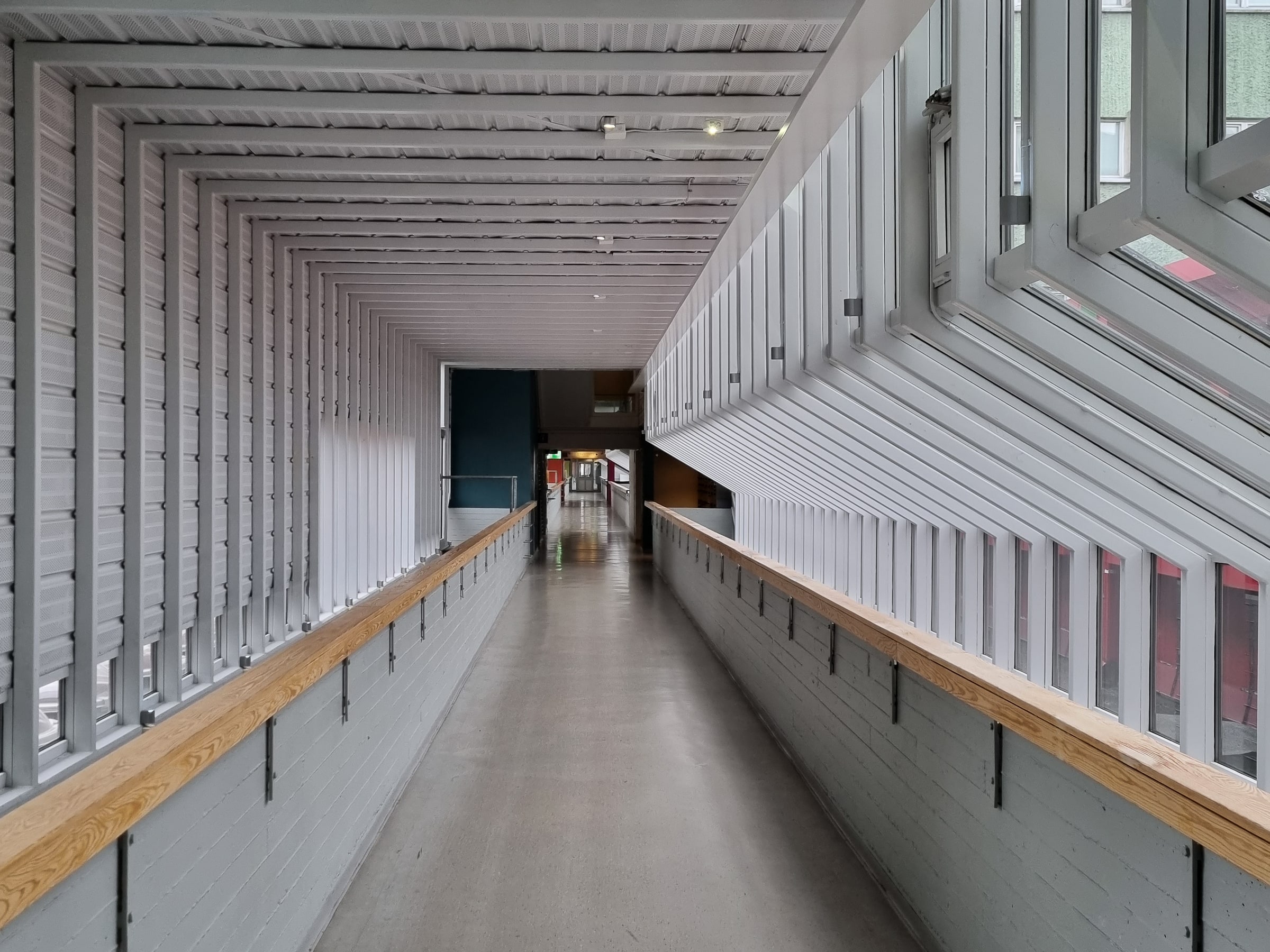 A long white corridor inside Sparta student housing in Lund.