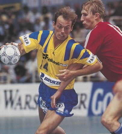 Swedish and Russian players contest the ball during a European handball match
