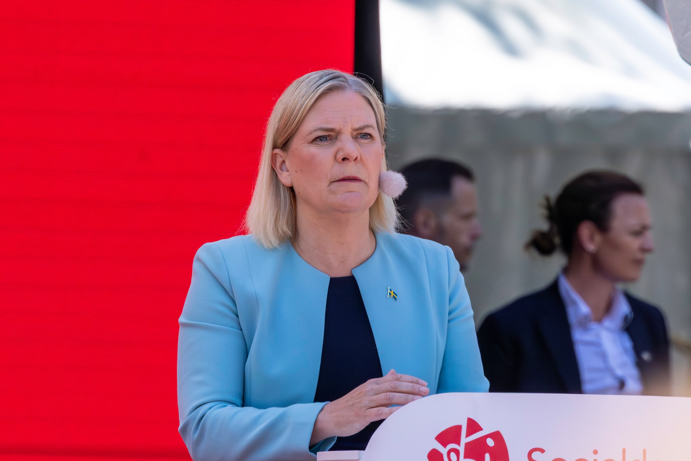 Social Democratic leader Magdalena Andersson stands at an Almedalen Week lectern in June 2025.